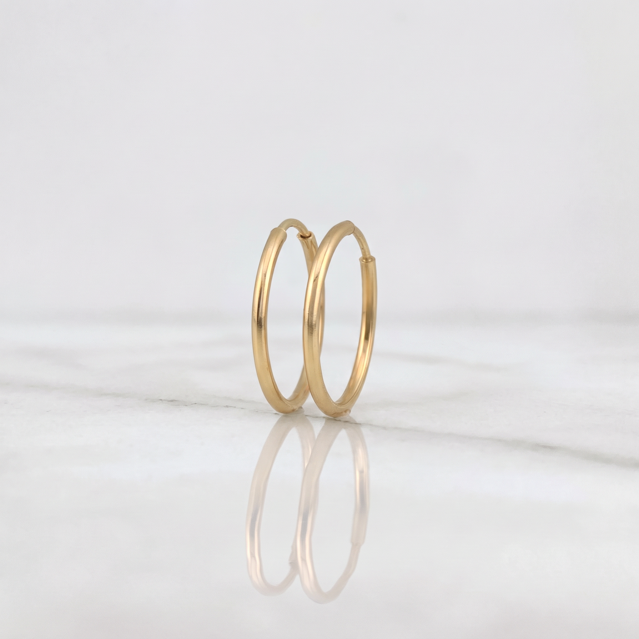 Candongas Aro Liso 0.45g / 1/2 in Oro Amarillo 18K