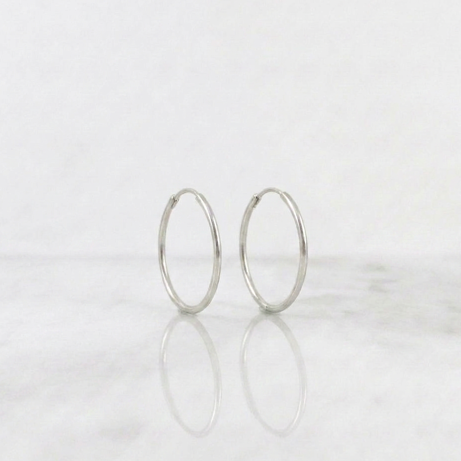 Candongas Aro Liso 0.6gr / 1/2 in / Oro Blanco 18K *