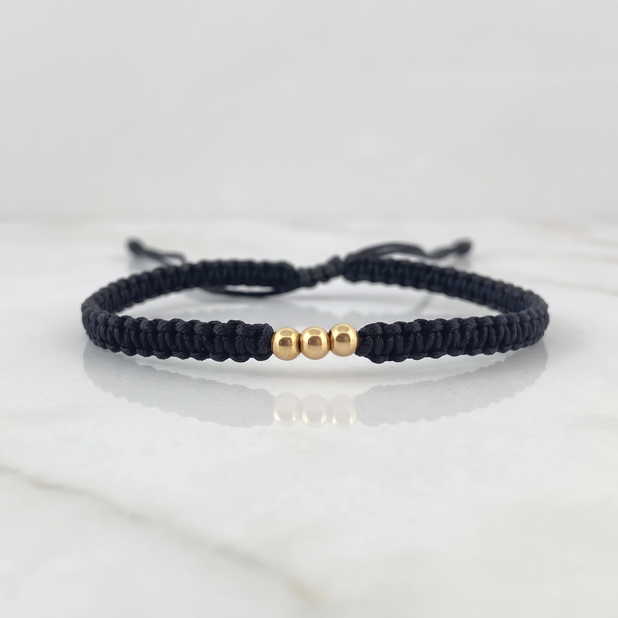 Pulsera Negra 3mm 3 Und Bolas Lisas Oro Amarillo 18K (A.C)