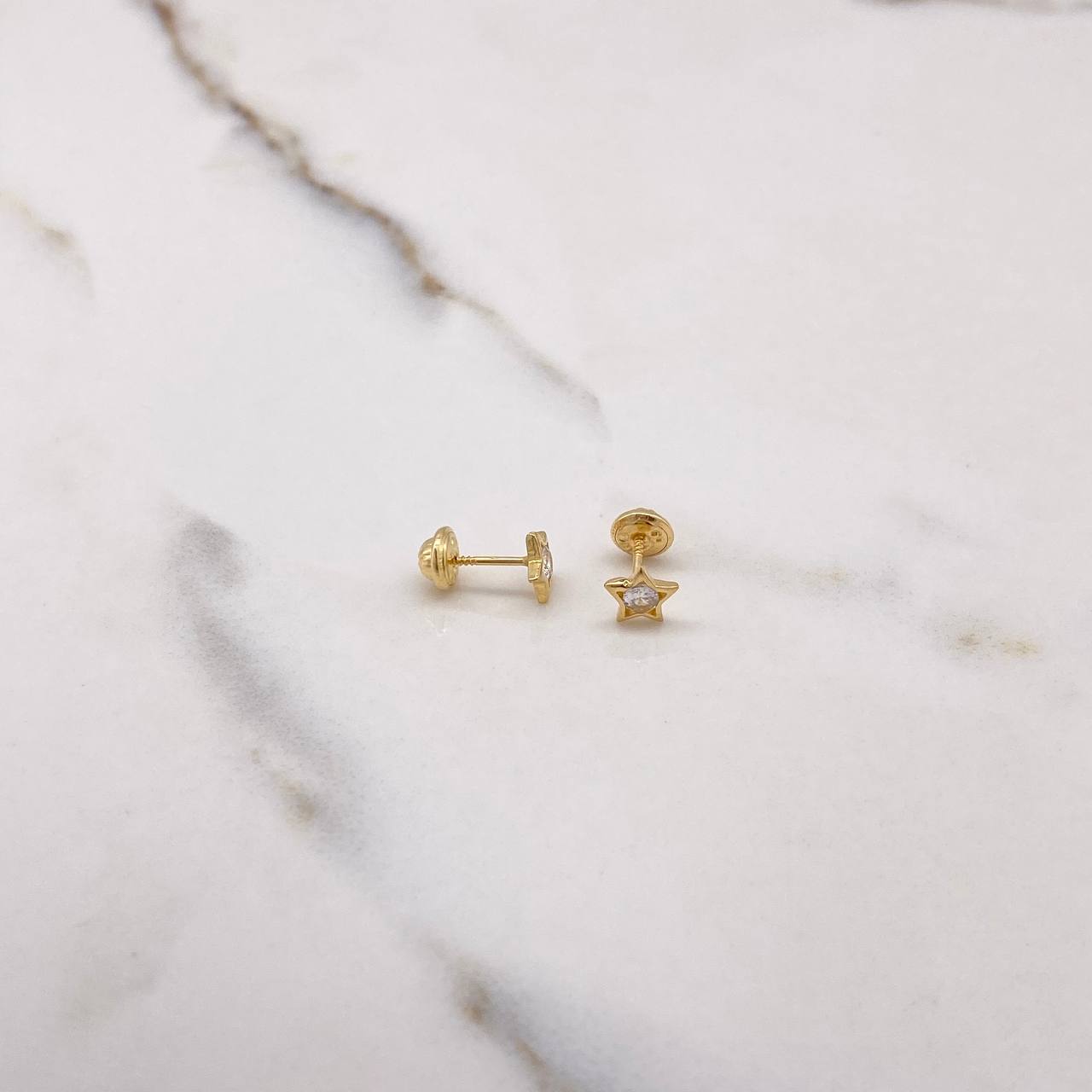 Topos Estrella 0.85gr / Circon Blanco Oro Amarillo $