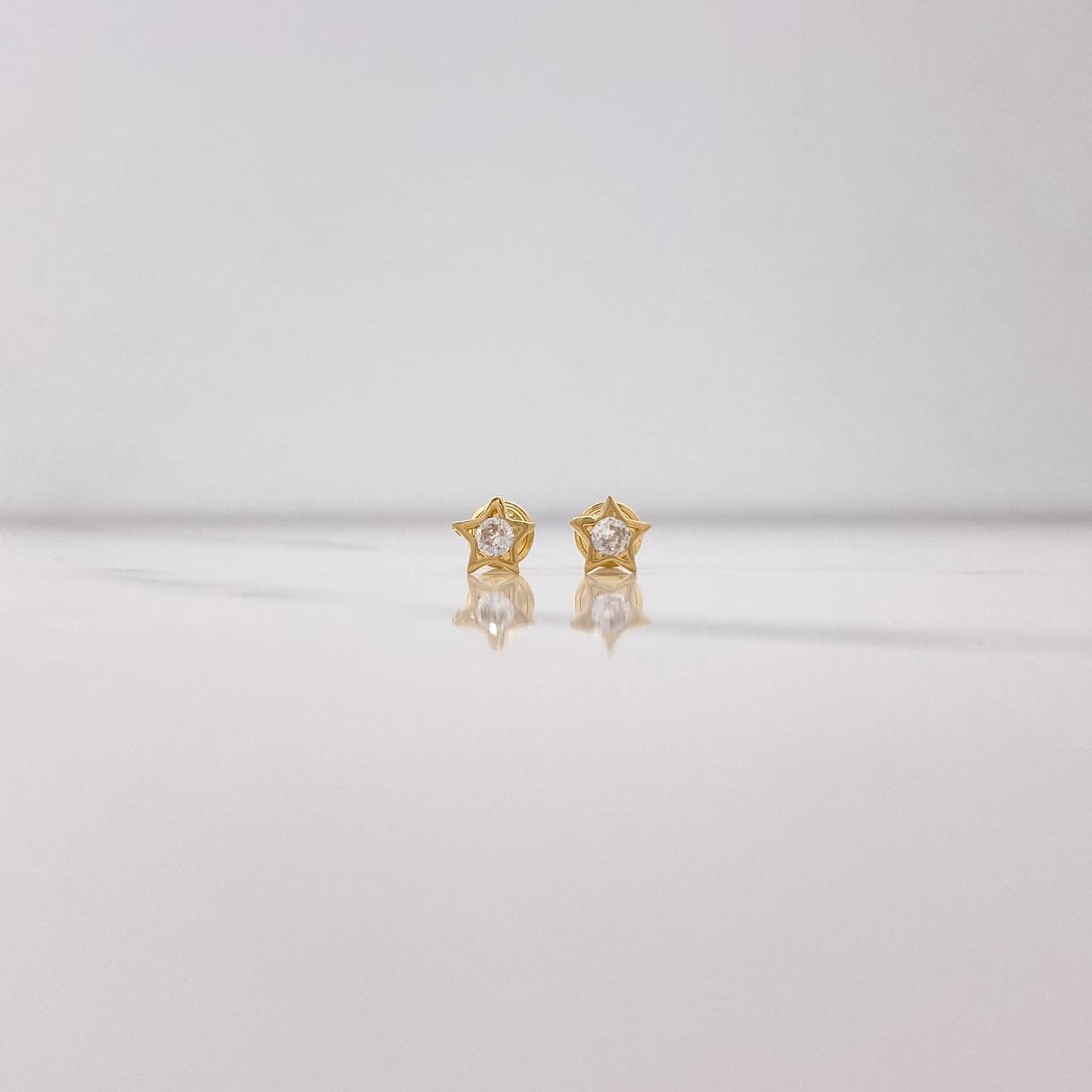 Topos Estrella 0.85gr / Circon Blanco Oro Amarillo $