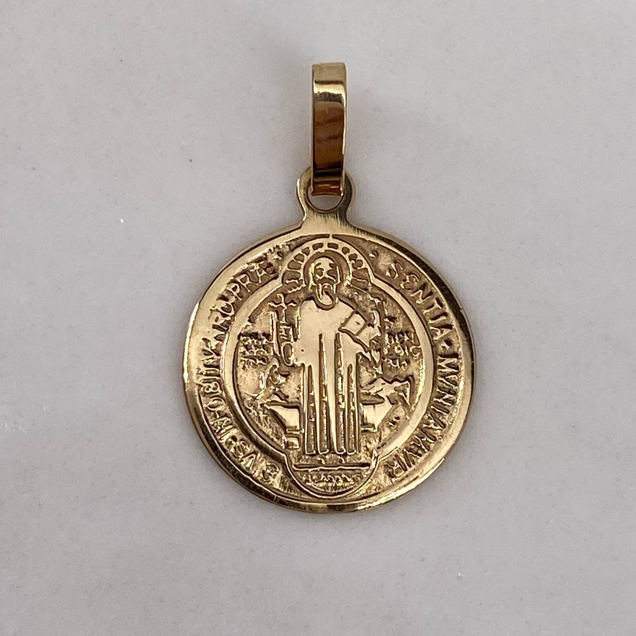 Dije San Benito  1.35gr / 2cm / Liso Oro Amarillo$