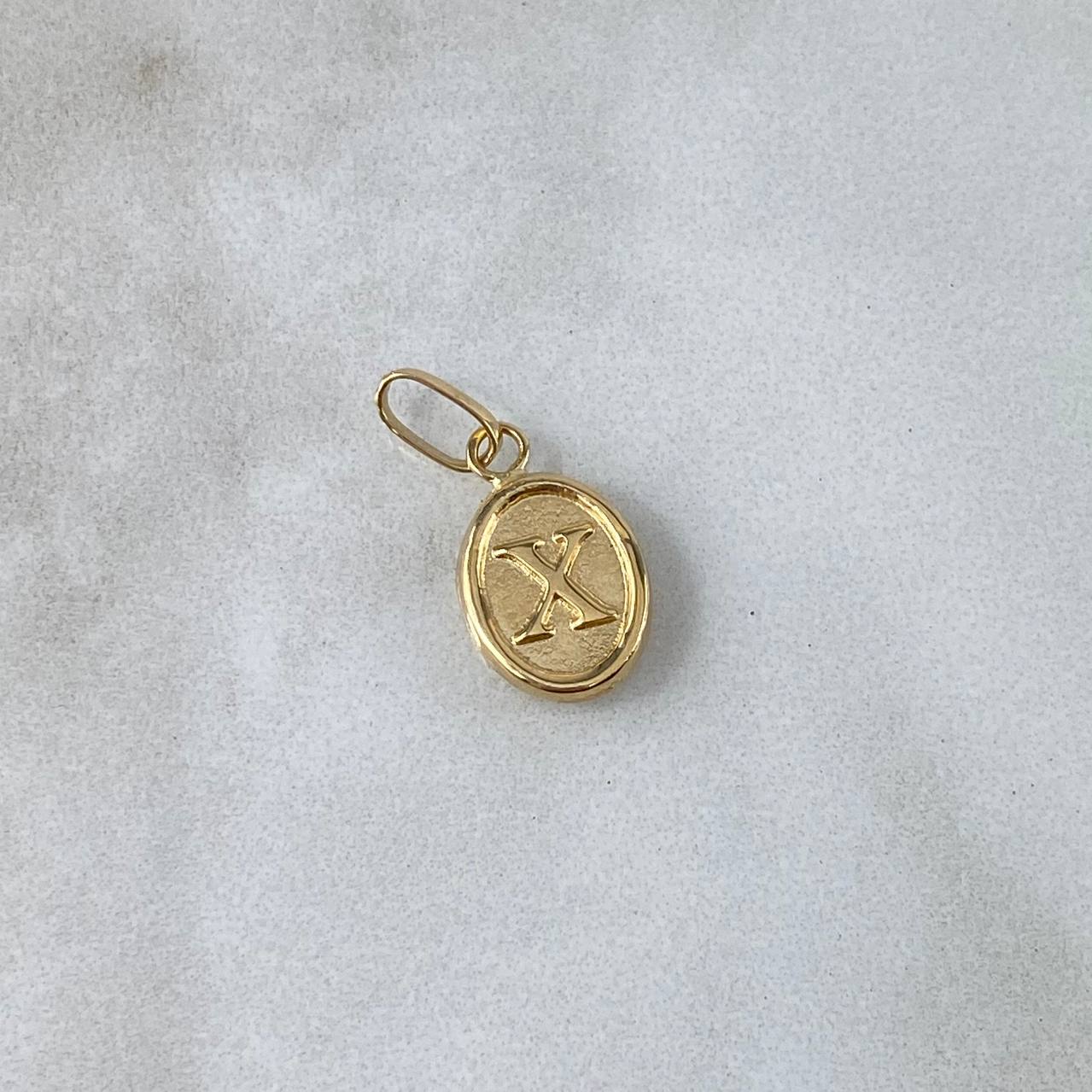 Dije Letra X Ovalada 0.4gr / 1.8cm / Troquelada Oro Amarillo