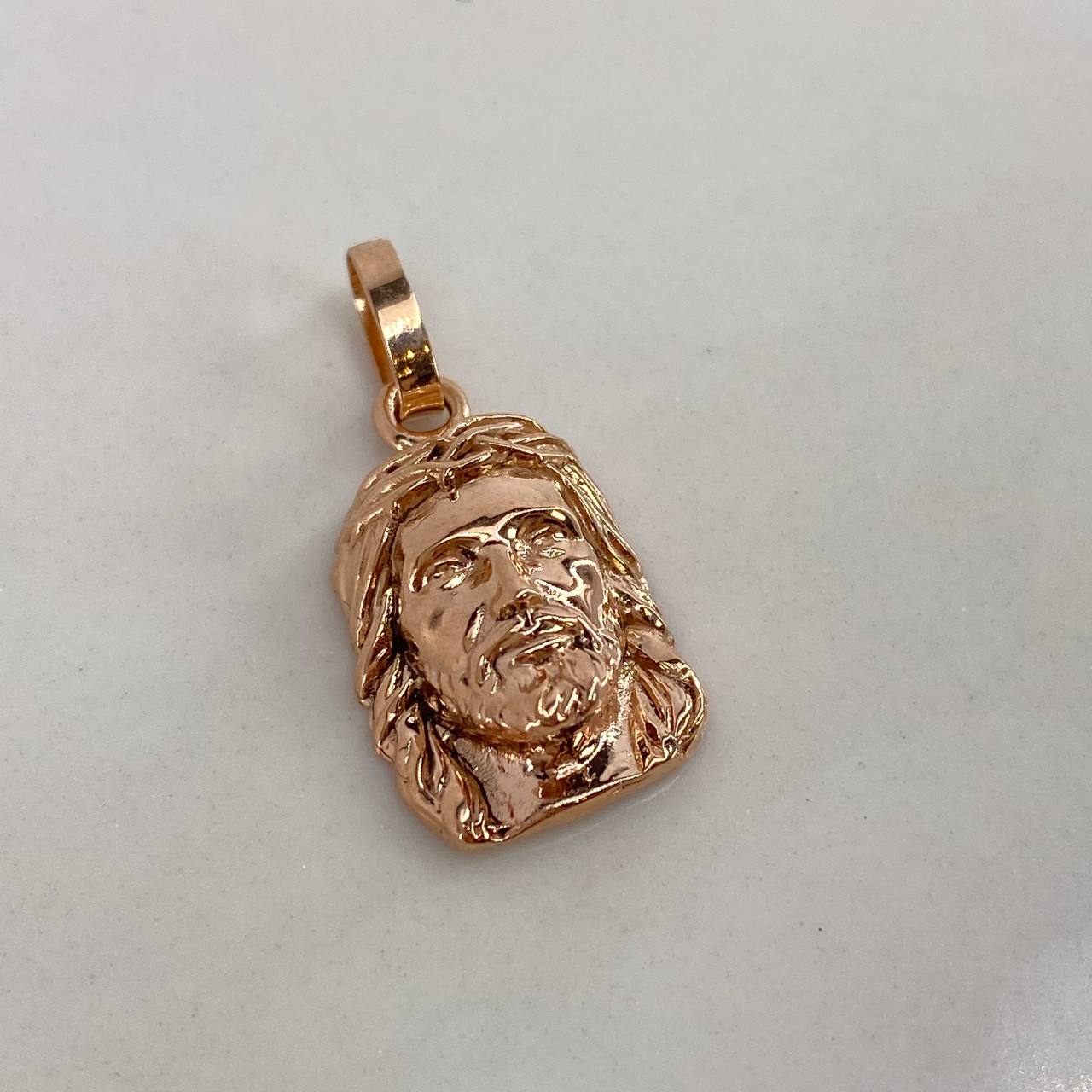 Dije Rostro Cristo  1.65gr / 2cm / Liso  Oro Rosa $