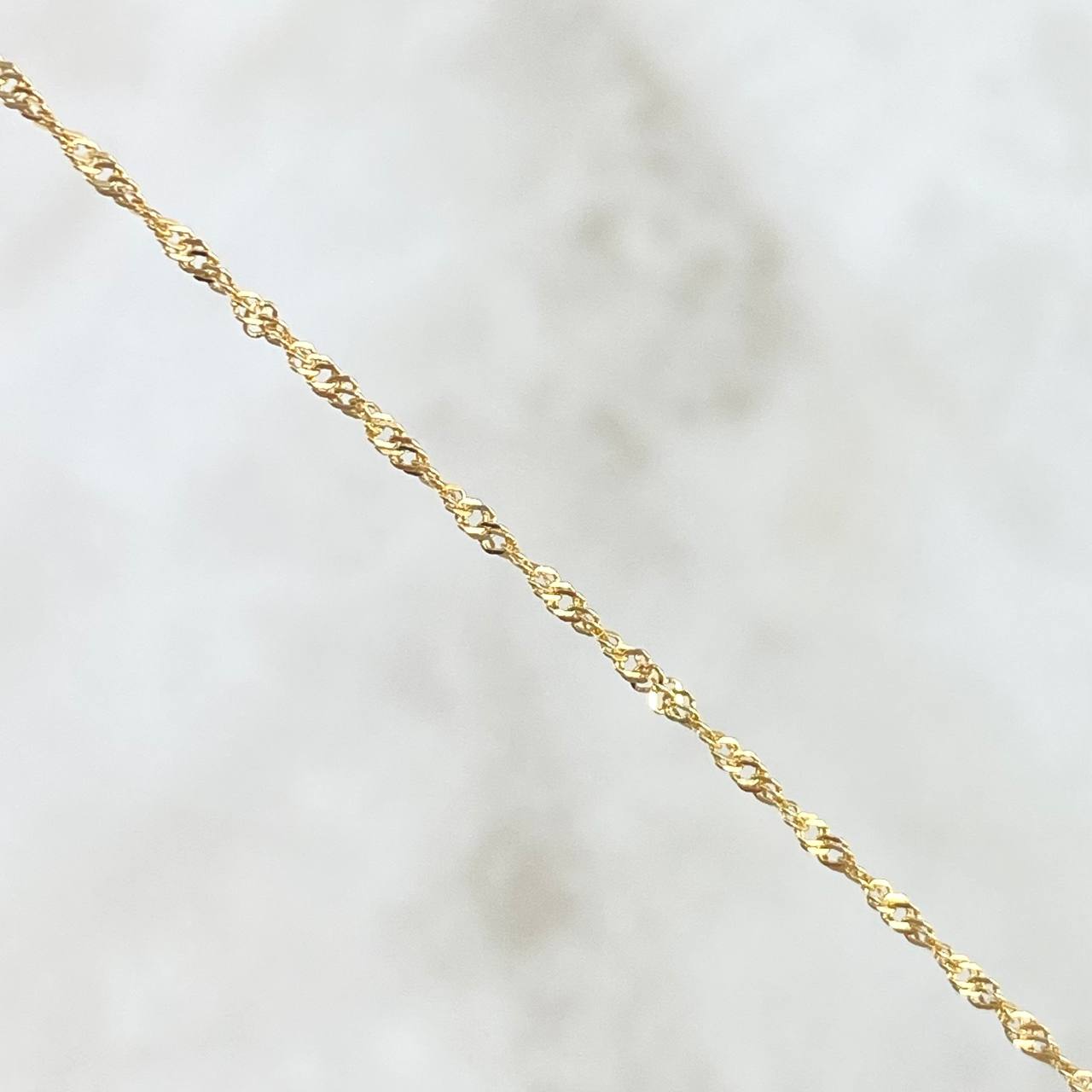 Cadena Singapur 1.55gr / 17 3/4 in / 1.2mm Oro Amarillo +3 18K *