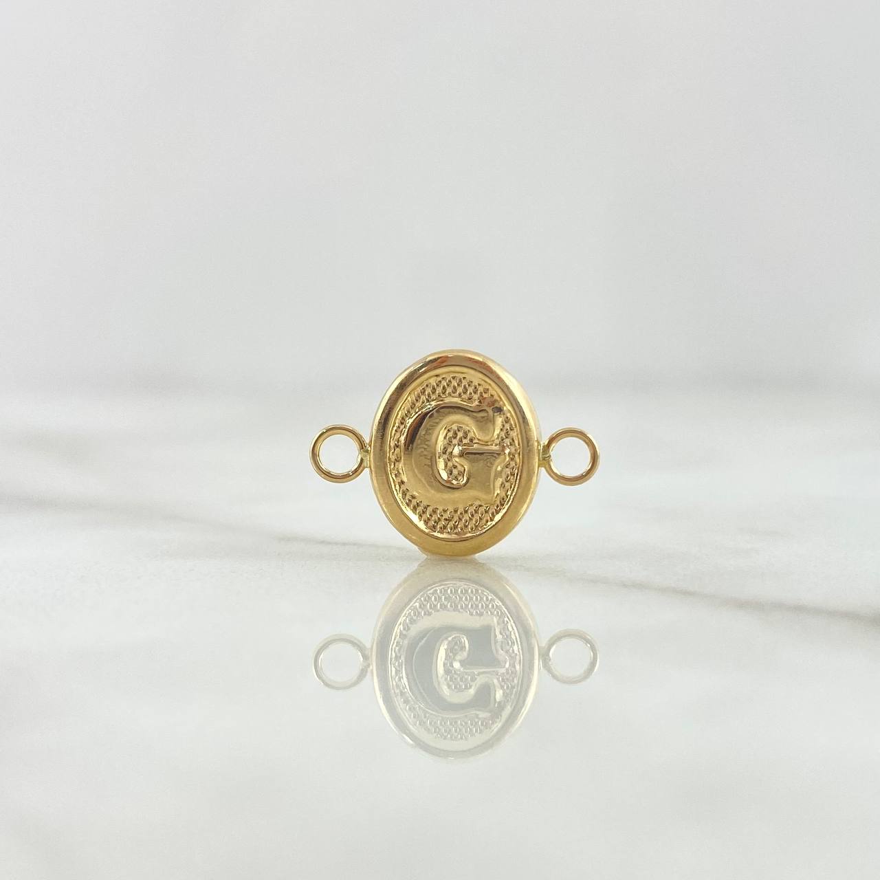 Herraje Letra G 0.4gr / 1.6cm / Ovalado Texturizado Oro Amarillo 18K