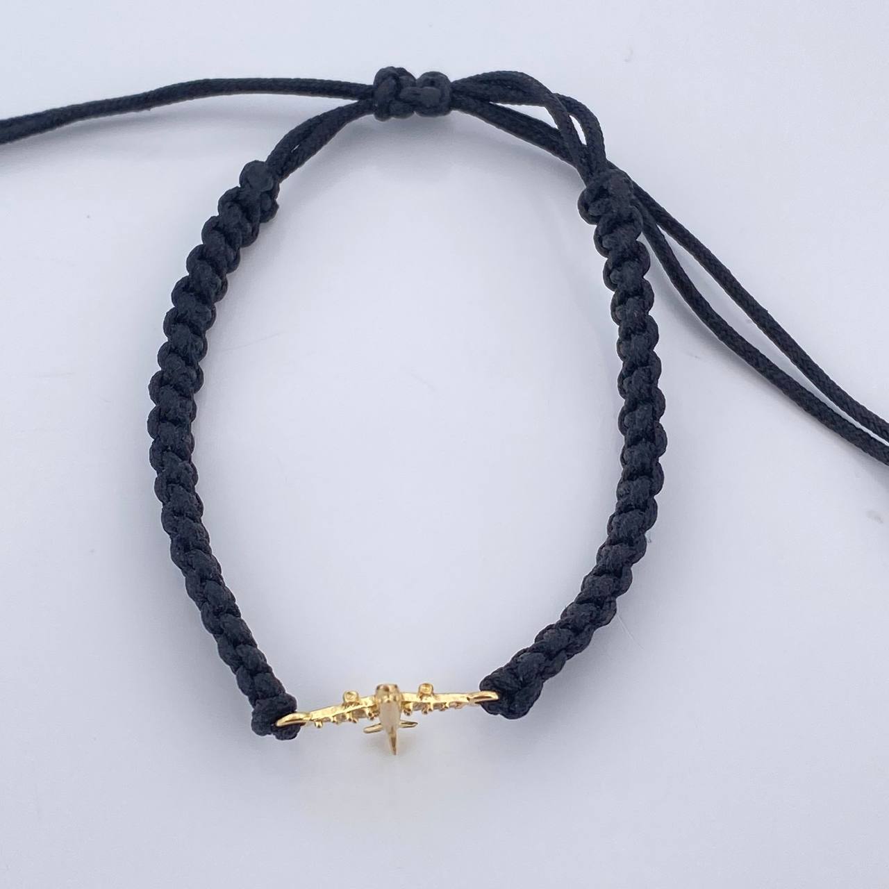 Pulsera Tejida Negra Avión 0.6gr / Oro Amarillo 18K %