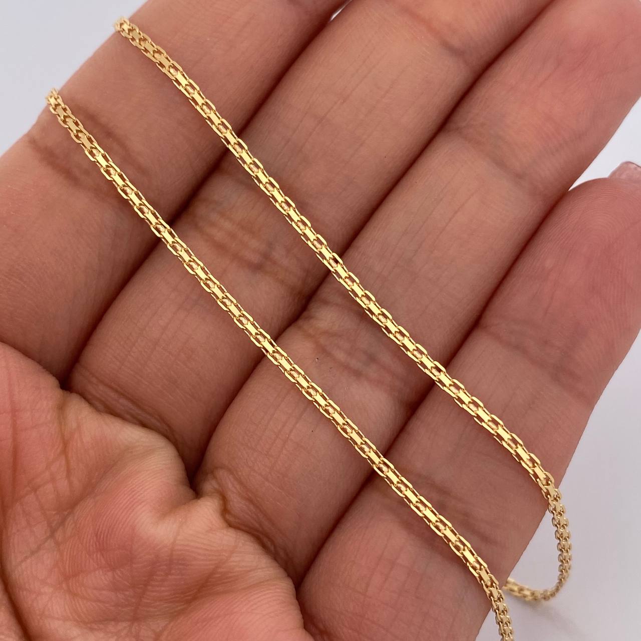 Cadena China 3.05gr / 23 3/4 in / 1.4mm Oro Amarillo +1 18K %