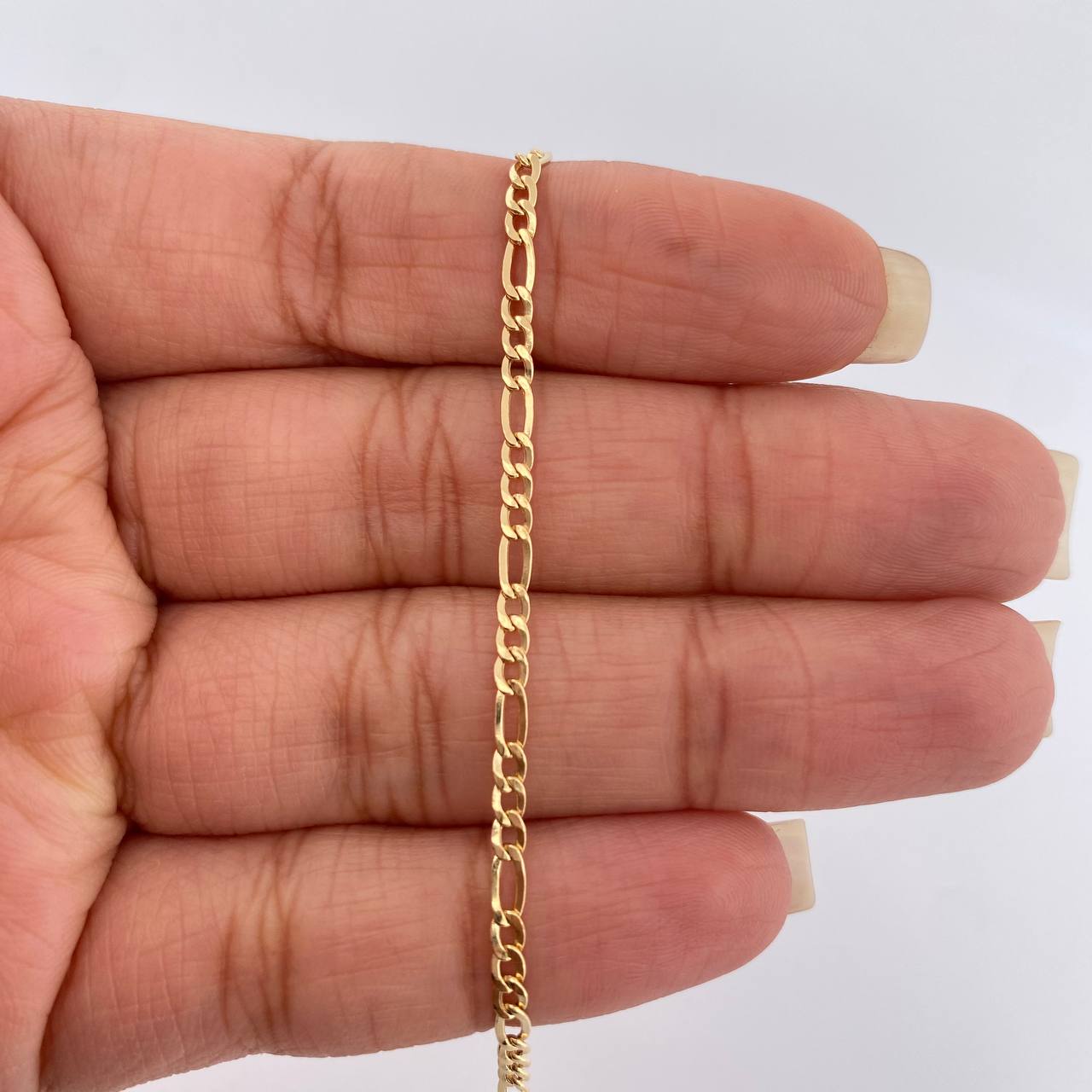 Pulso Figaro 1.3gr / 6 3/4 in / 2.3mm Oro Amarillo +1 18K %