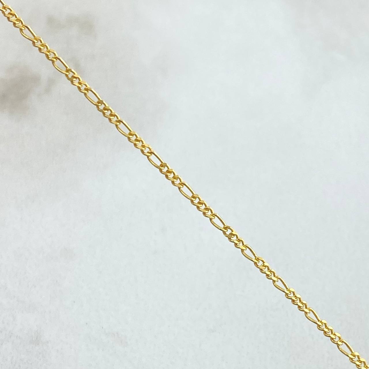 Cadena Figaro 2.25gr / 23 1/2 in / 1.1mm Oro Amarillo +1 18K ©
