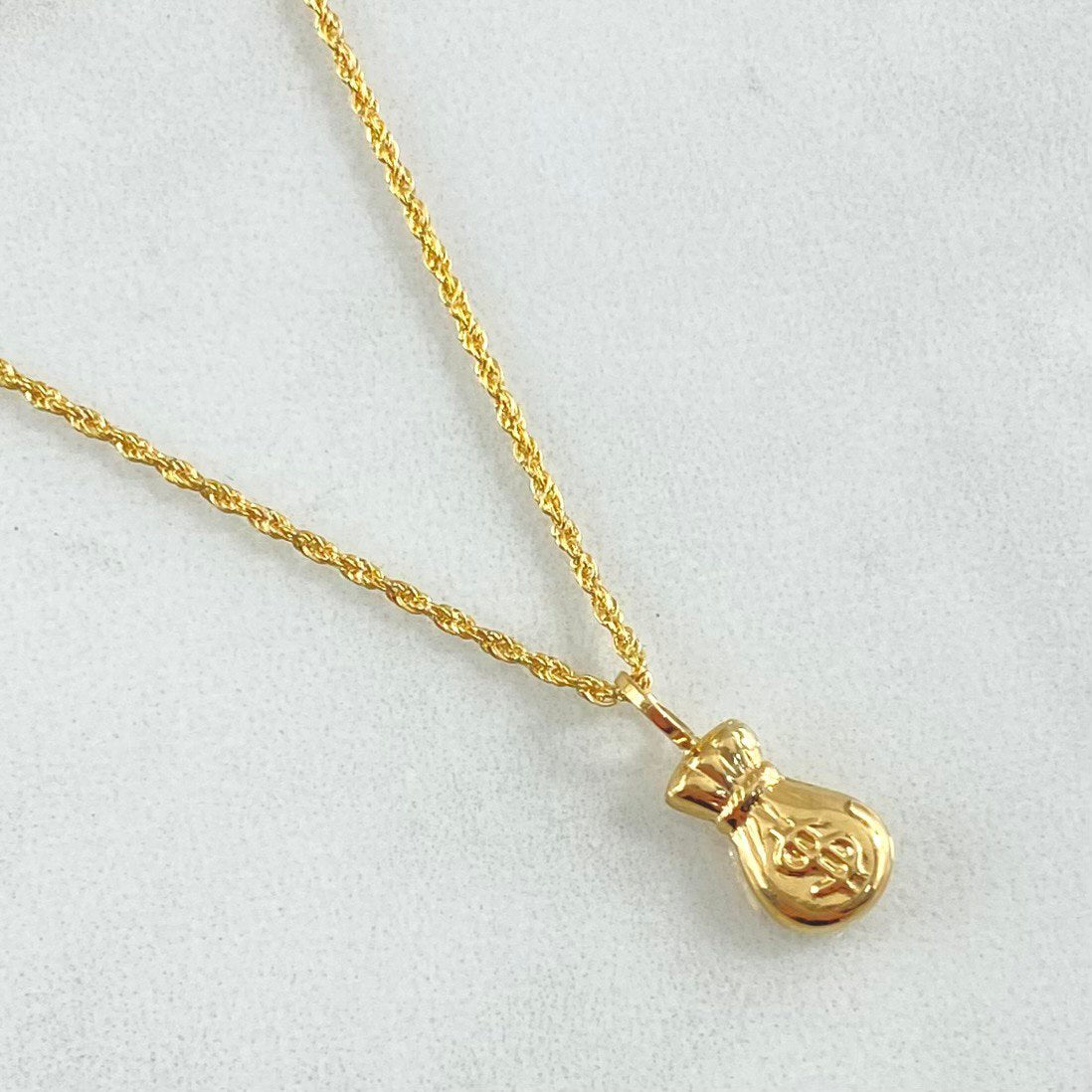 Set Rope Chain 1.2gr / 23.6in / 1.2mm + Pendant Money Bag 0.5gr / 1.5cm (0.6in) / 1.7gr 18K Yellow Gold (Offer) ©