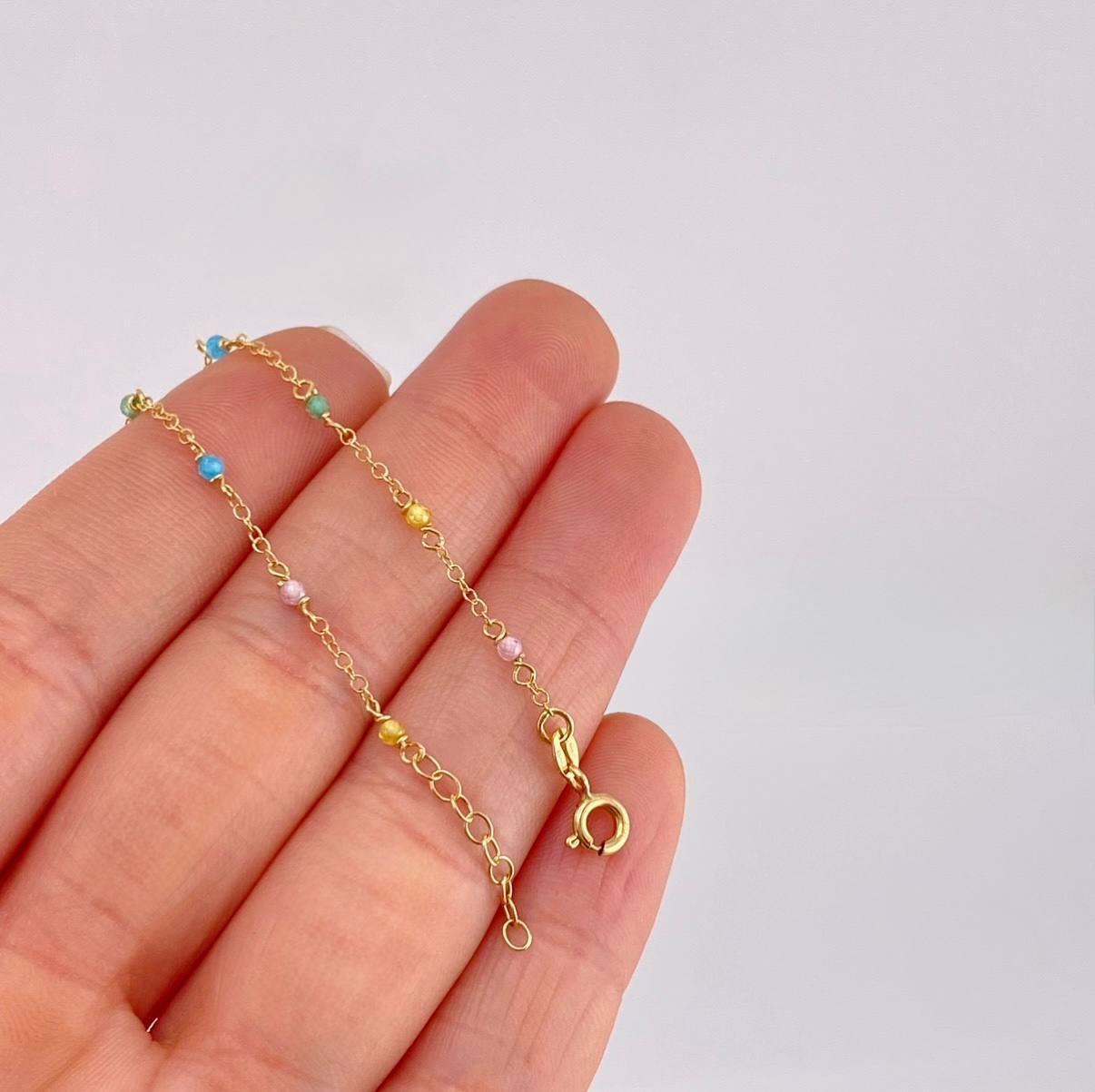 Pulso Modulable Aro Seguido Chispas Arcoiris 1.05g / 6 1/2 in - 5 3/4 in / 1.3mm Oro Amarillo 18K