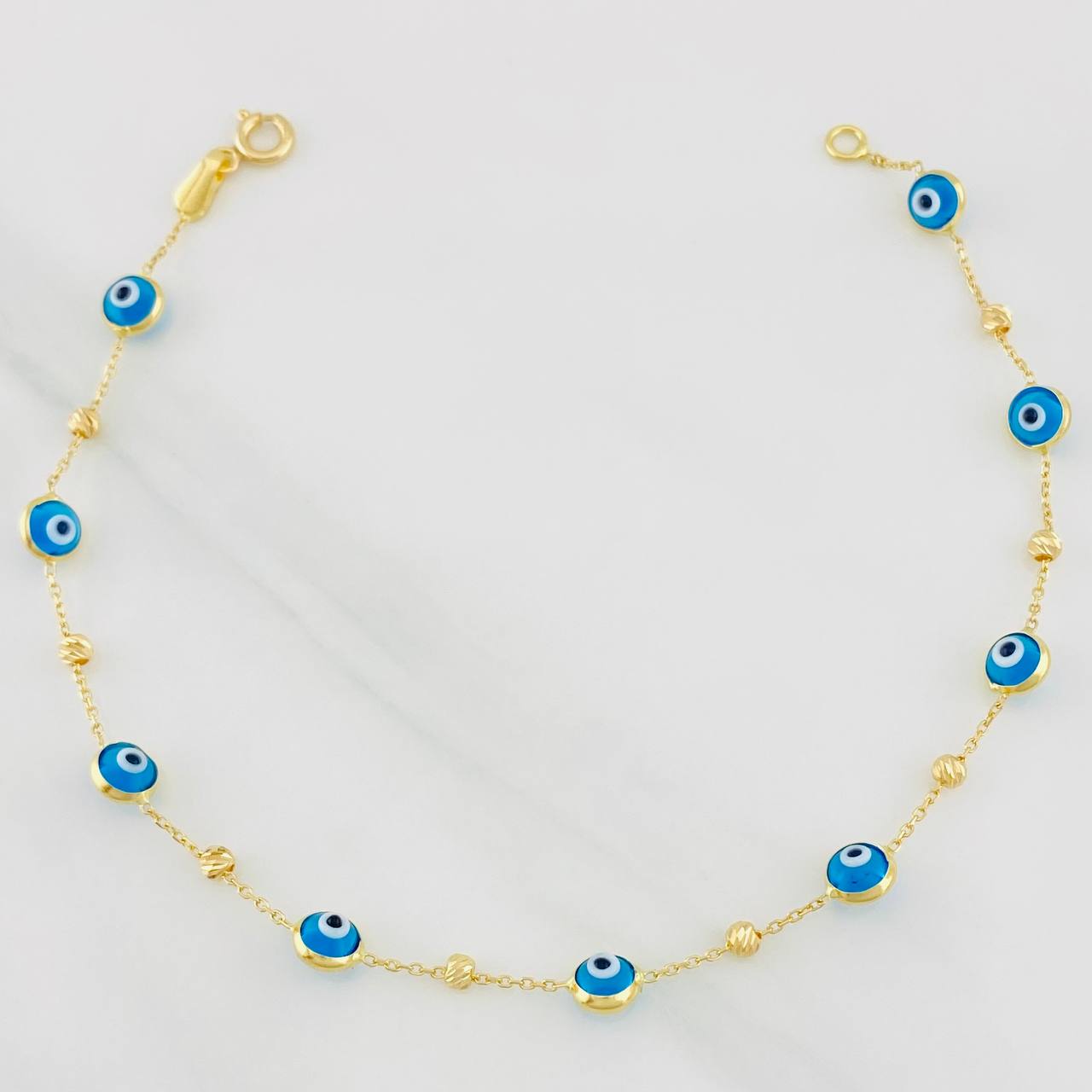 Pulso Aro Seguido Ojos Turcos 2.2g / 7 3/4 in / 0.85mm Oro Amarillo 18K