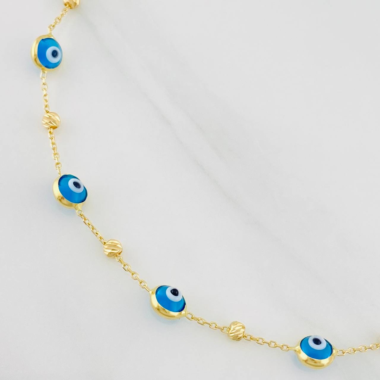 Pulso Aro Seguido Ojos Turcos 2.2g / 7 3/4 in / 0.85mm Oro Amarillo 18K