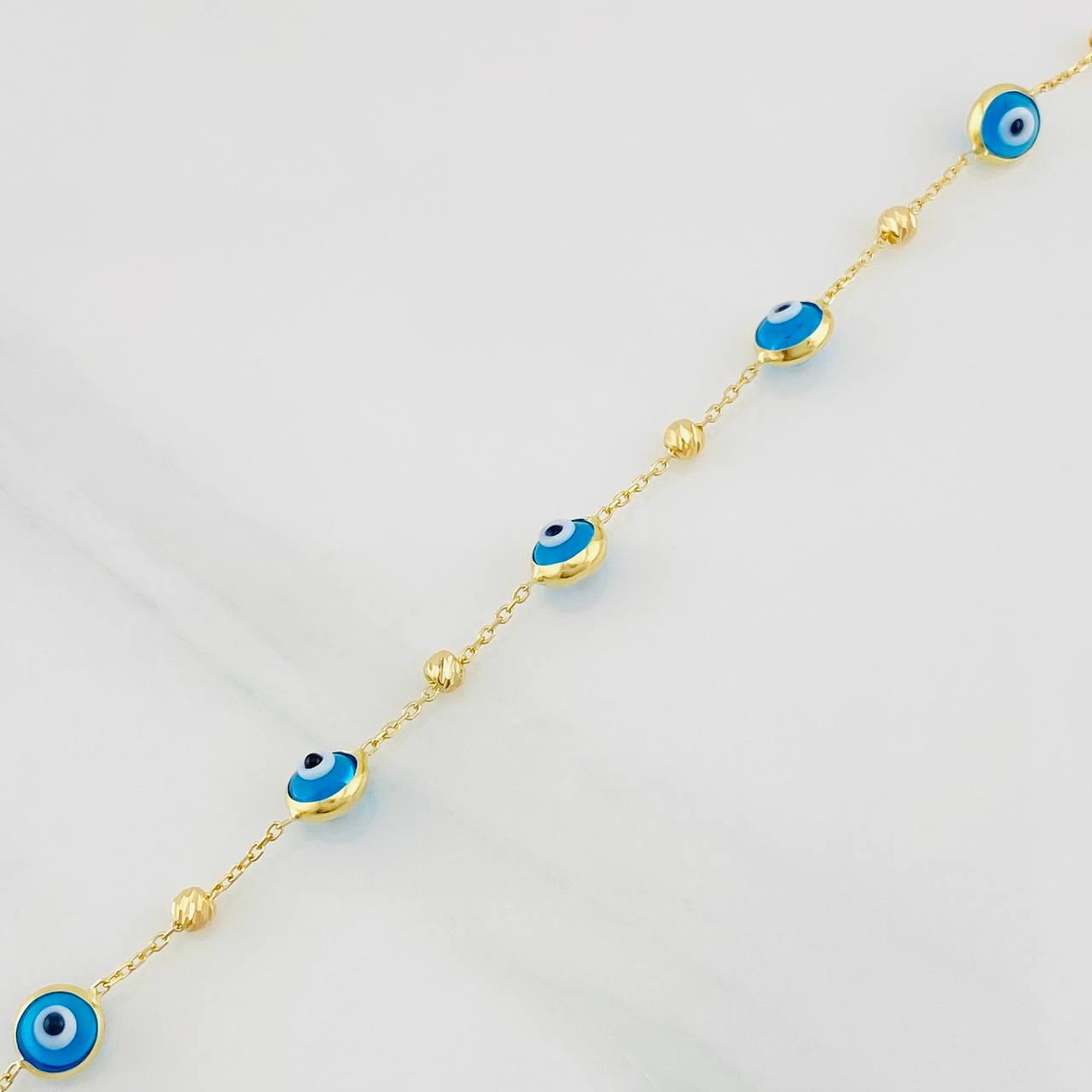 Pulso Aro Seguido Ojos Turcos 2.2g / 7 3/4 in / 0.85mm Oro Amarillo 18K