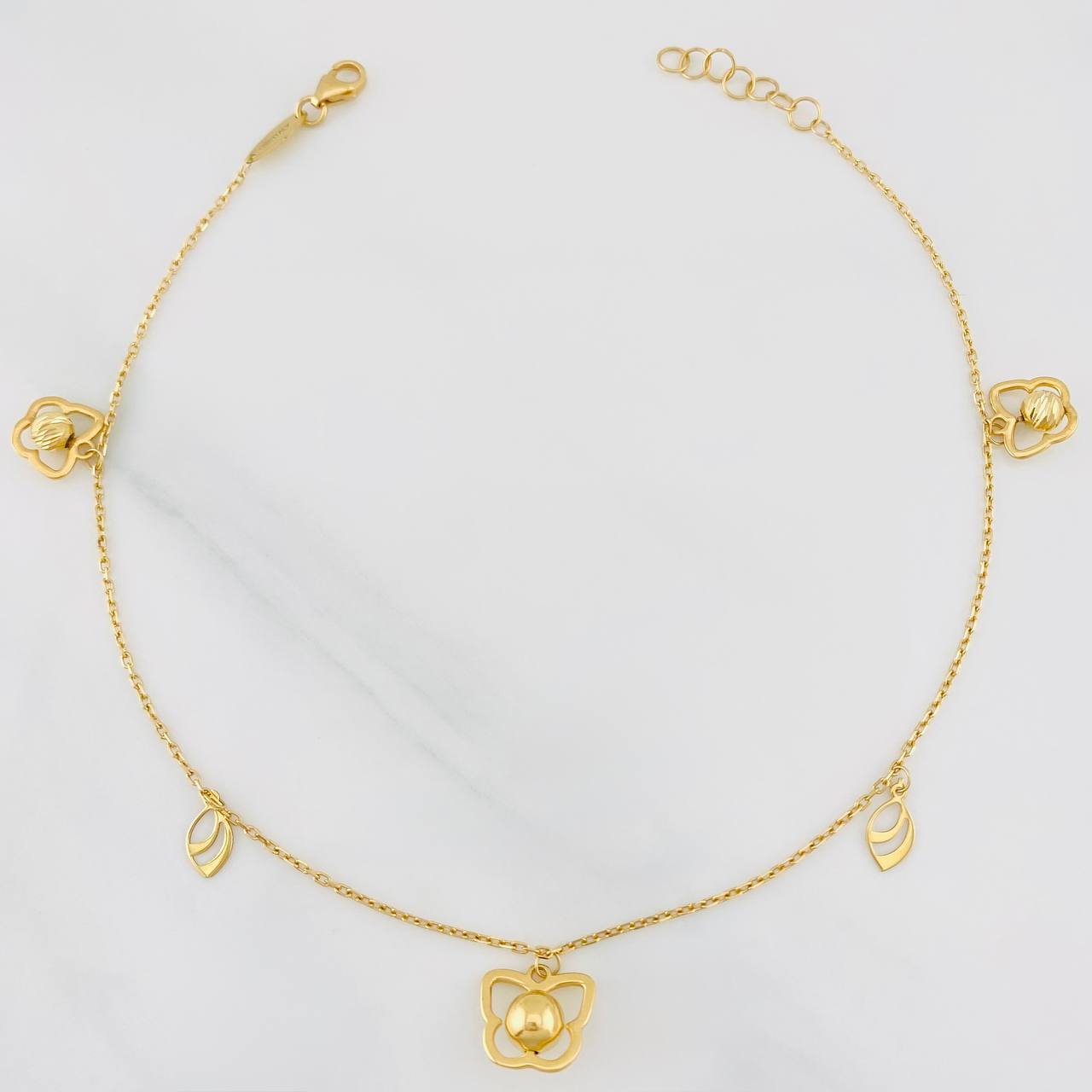 Tobillera Aro Seguido Figuras 2.65g / 9 3/4 in / 1mm Oro Amarillo 18K