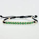Pulsera Tejida Negra Retazo Tennis Oro Amarillo 18K