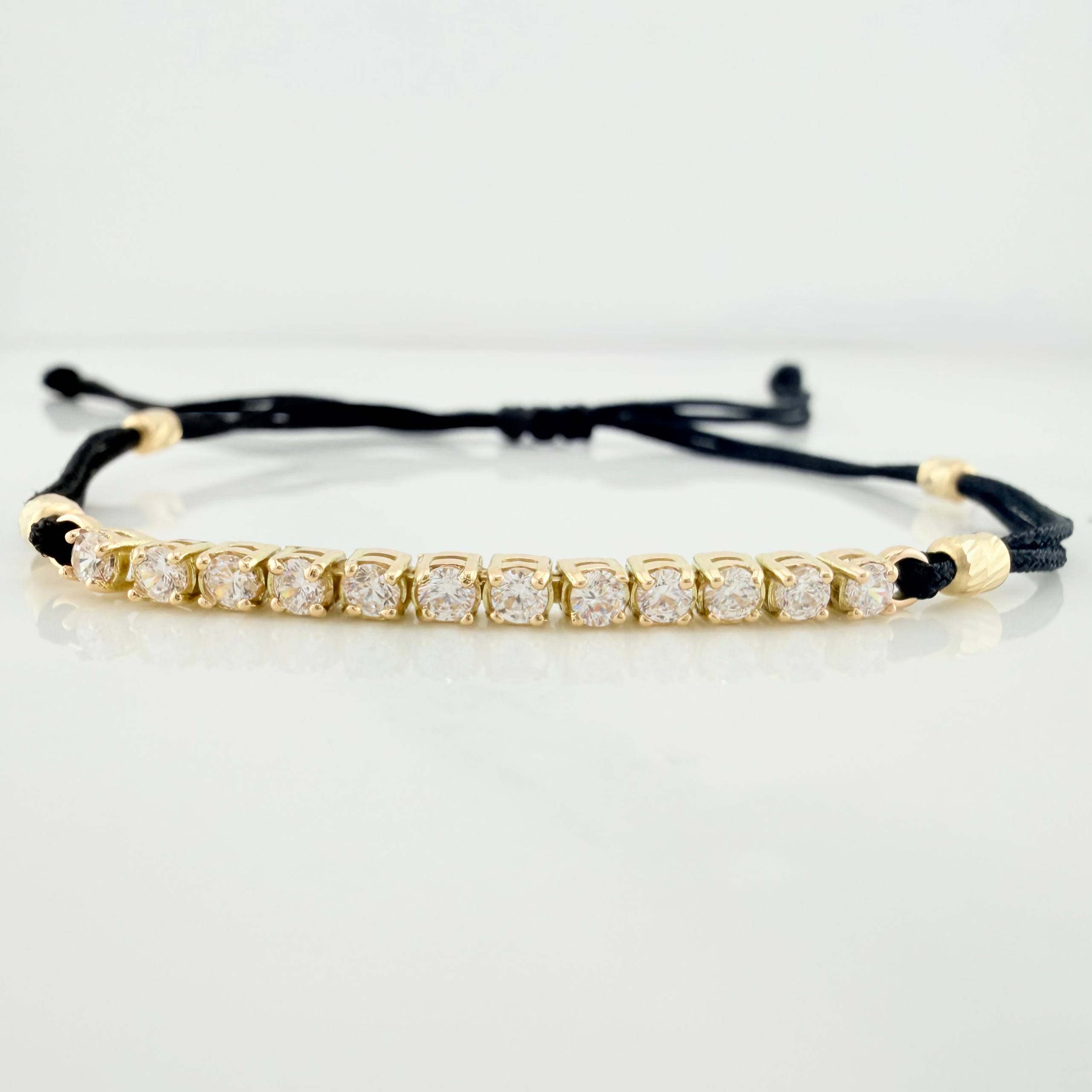 Pulsera Tejida Negra Retazo Tennis Oro Amarillo 18K