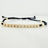 Pulsera Tejida Negra Retazo Tennis Oro Amarillo 18K