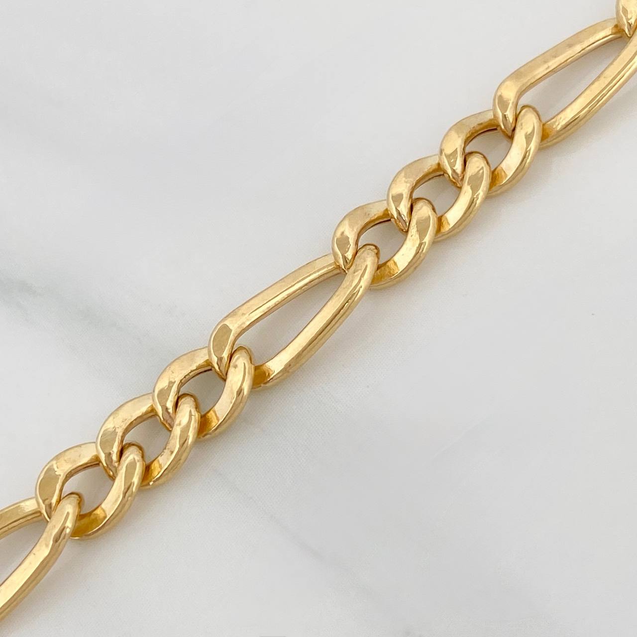 Cadena Figaro 19.45gr / 24 in / 5.04mm Oro Amarillo +1 18K $