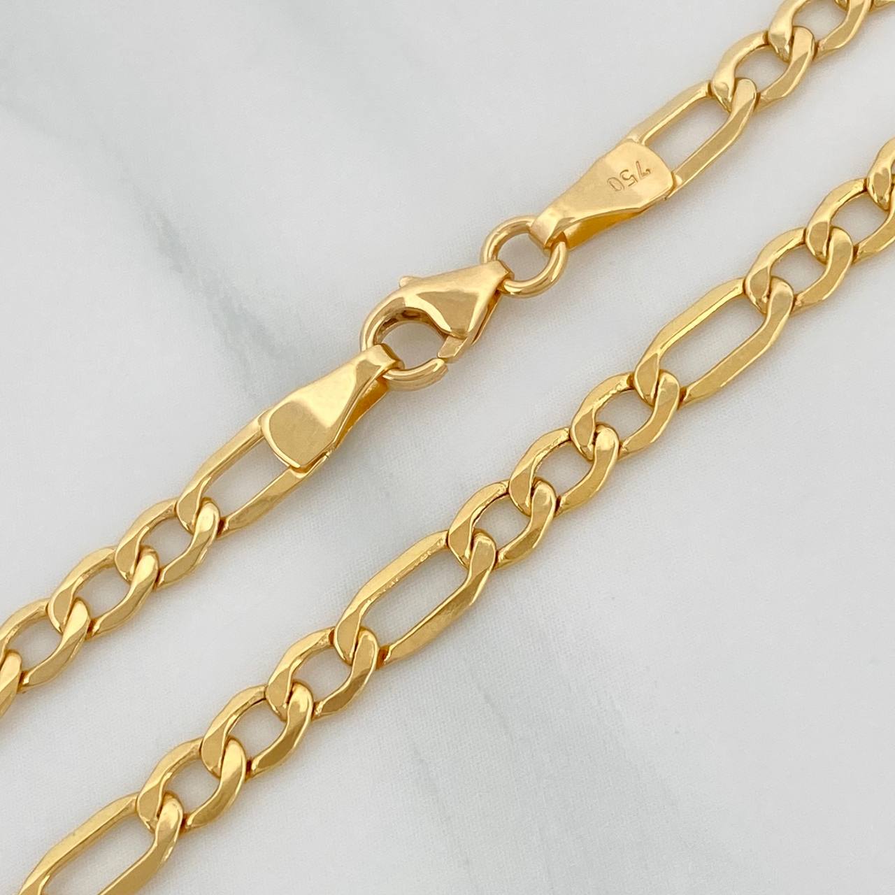 Cadena Figaro 5.9gr / 25 1/2 in / 3.4mm Oro Amarillo +1 18K $