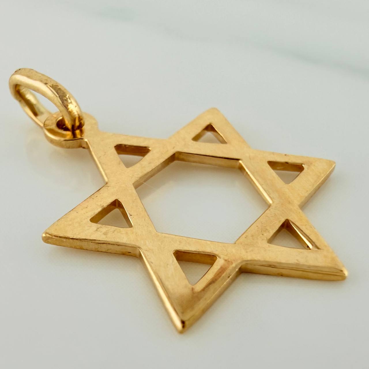 Dije Estrella De David 1.35gr / 1 in / Oro Amarillo 18K $