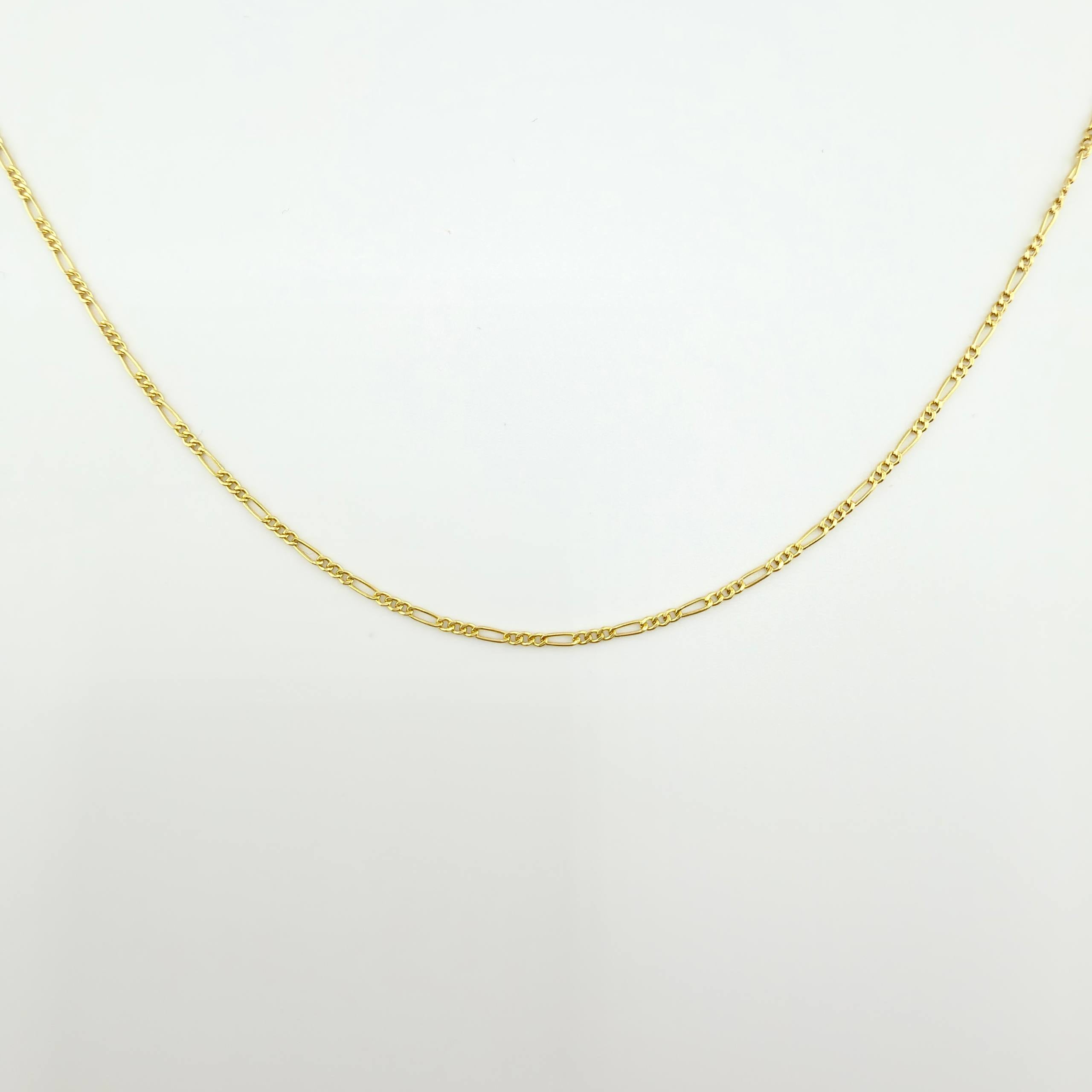 Figaro Chain 1.75gr / 23 1/2 in / 1.5mm Yellow Gold +1 18K ©