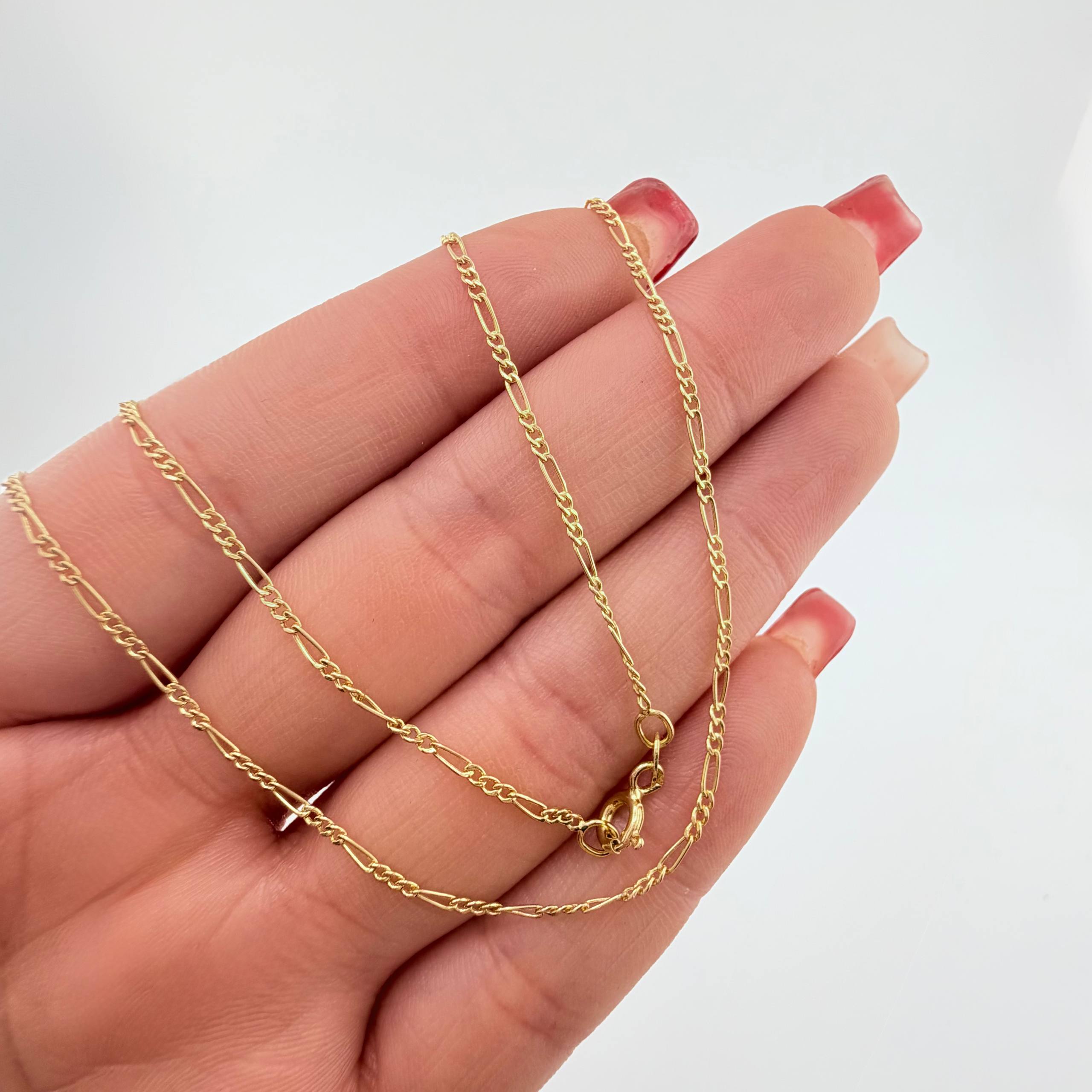 Figaro Chain 1.75gr / 23 1/2 in / 1.5mm Yellow Gold +1 18K ©