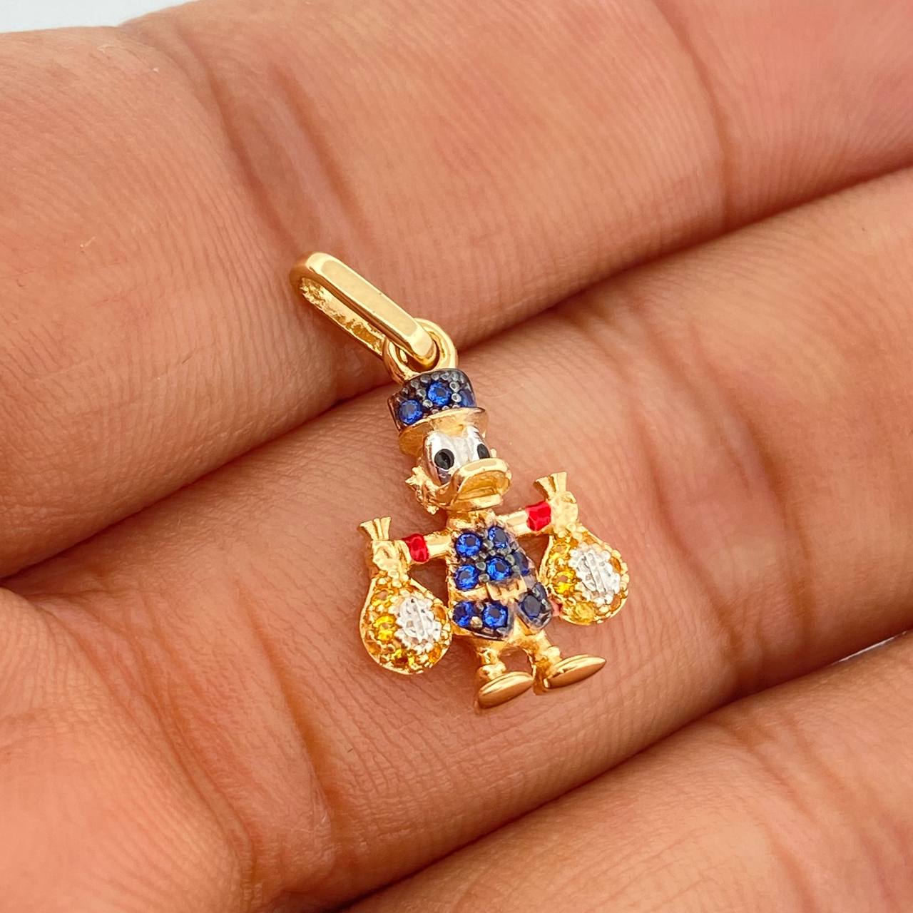 Dije Pato Bolsa Dinero 1.6gr / 3/4 in /  Tres Oros  18K %