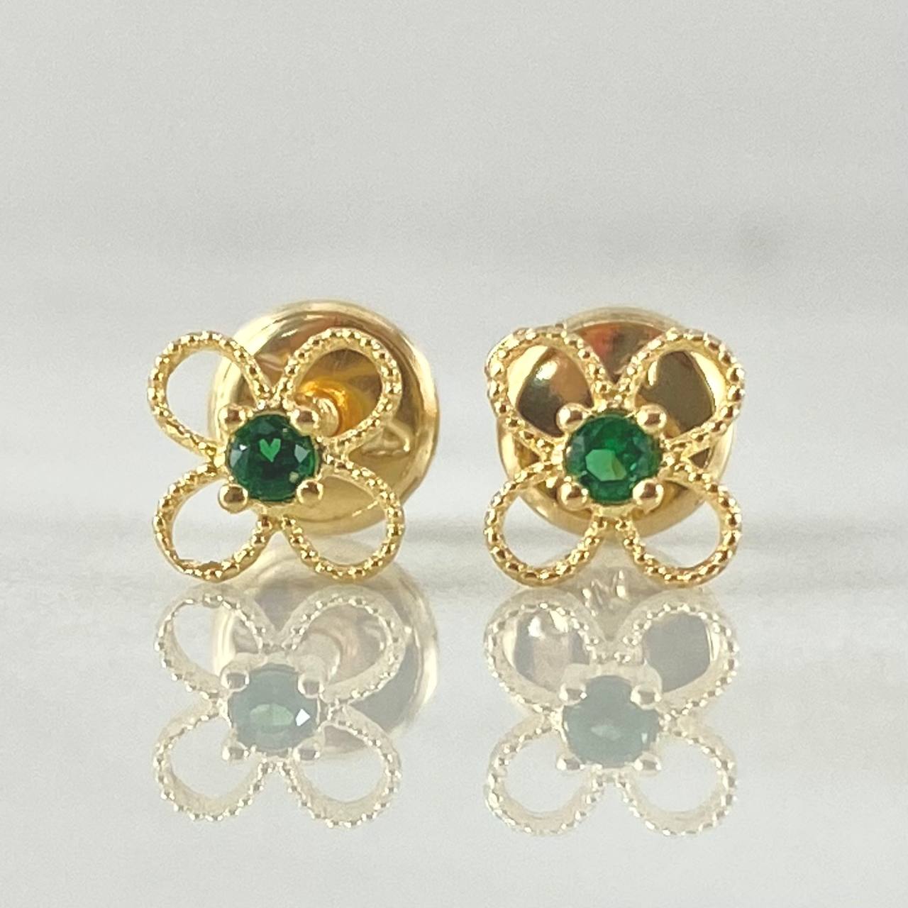 Topos Flor 0.65gr / Oro 18K ©