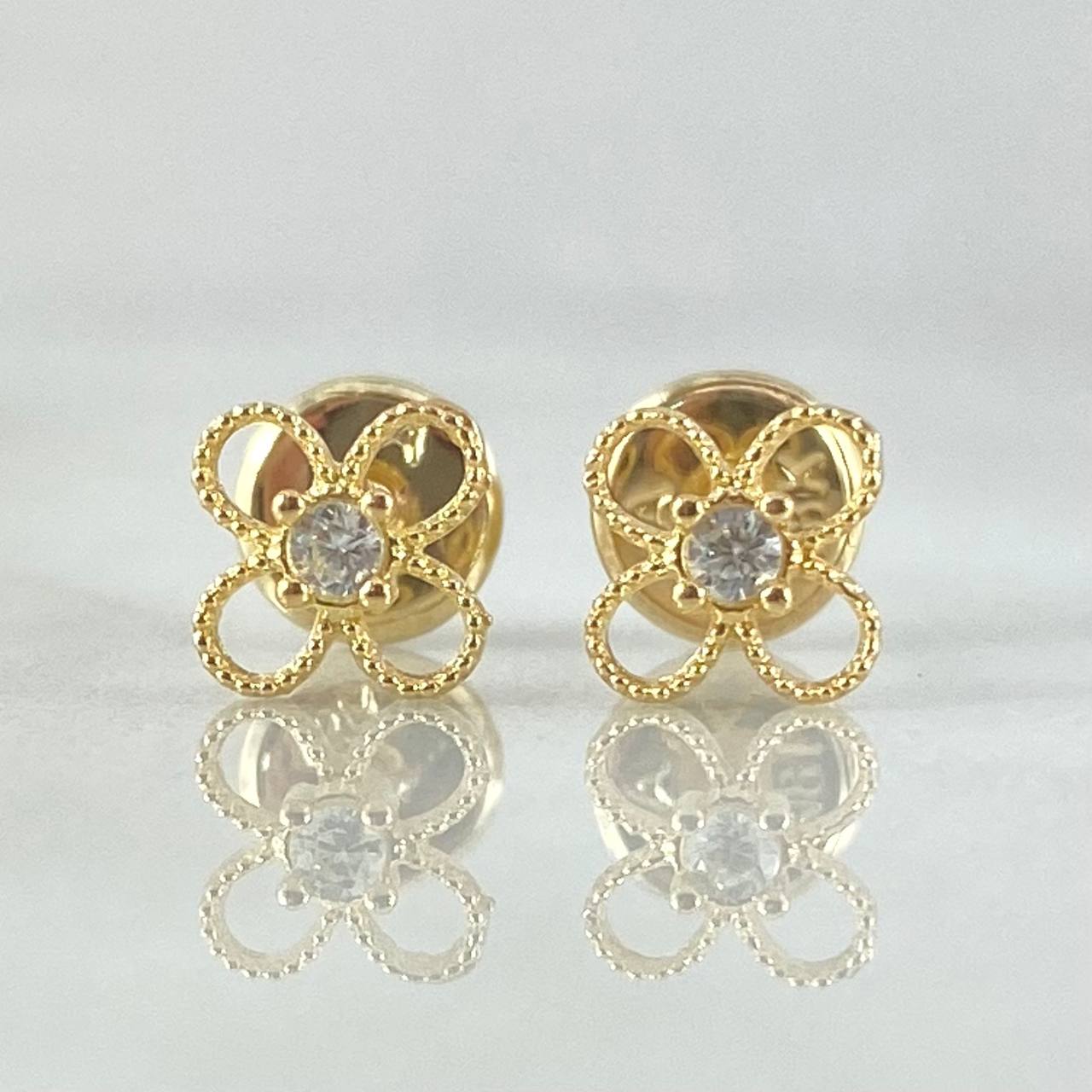 Topos Flor  0.65gr / Oro 18K ©