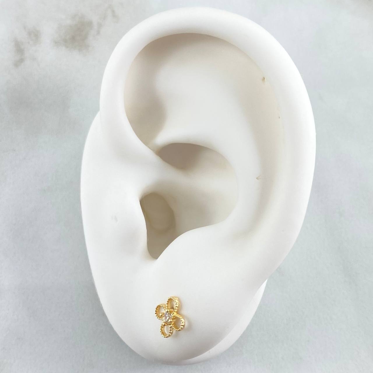 Topos Flor  0.65gr / Oro 18K ©