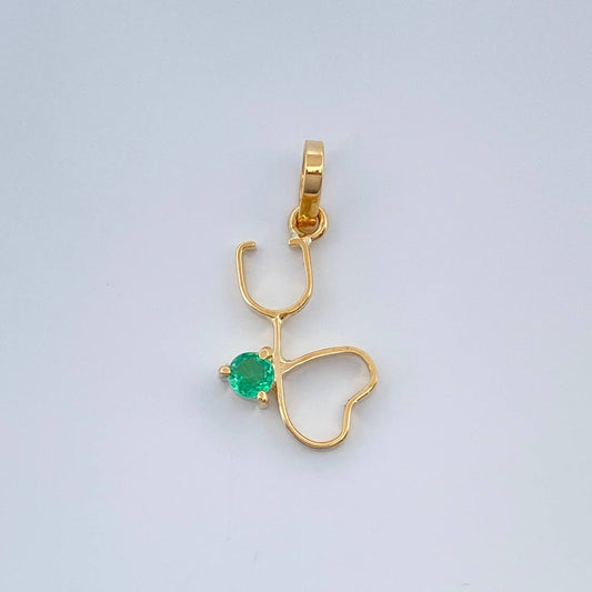 Dije Figura Fonendoscopio Esmeralda 07Pts 0.4gr / 3/4 in / Oro Amarillo 18K %