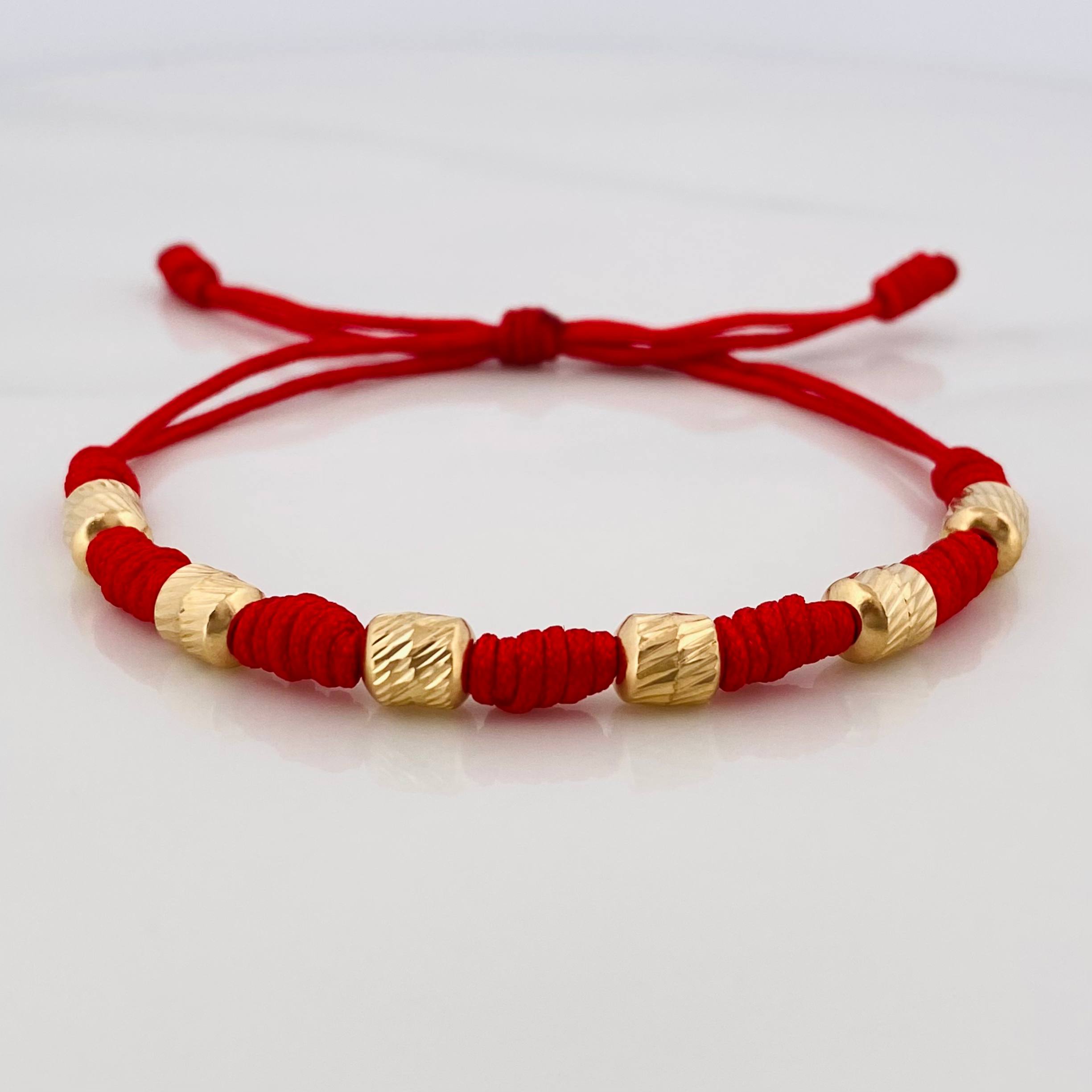 Red Woven Bracelet 7 Knots 6 Diamond Cut Cylinders Yellow Gold 18K