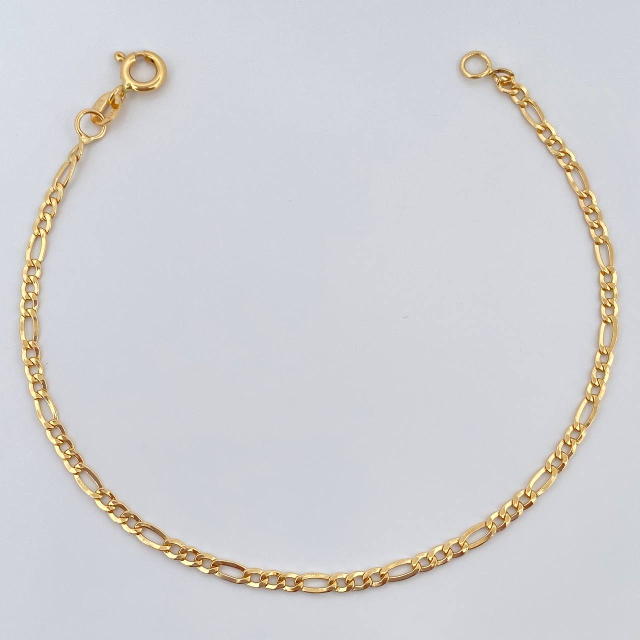 Pulso Figaro 1.45gr / 7 1/2 in / 2.36mm Oro Amarillo +1 18K %