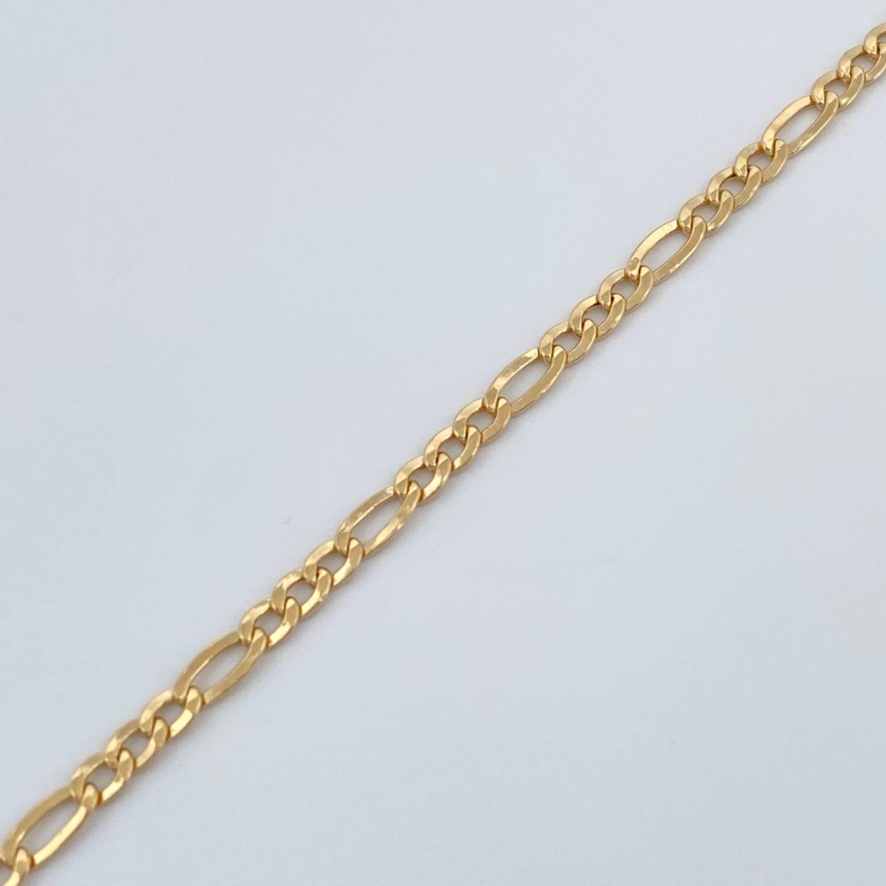 Pulso Figaro 1.4gr / 7 1/2 in / 1mm Oro Amarillo +1 18K &