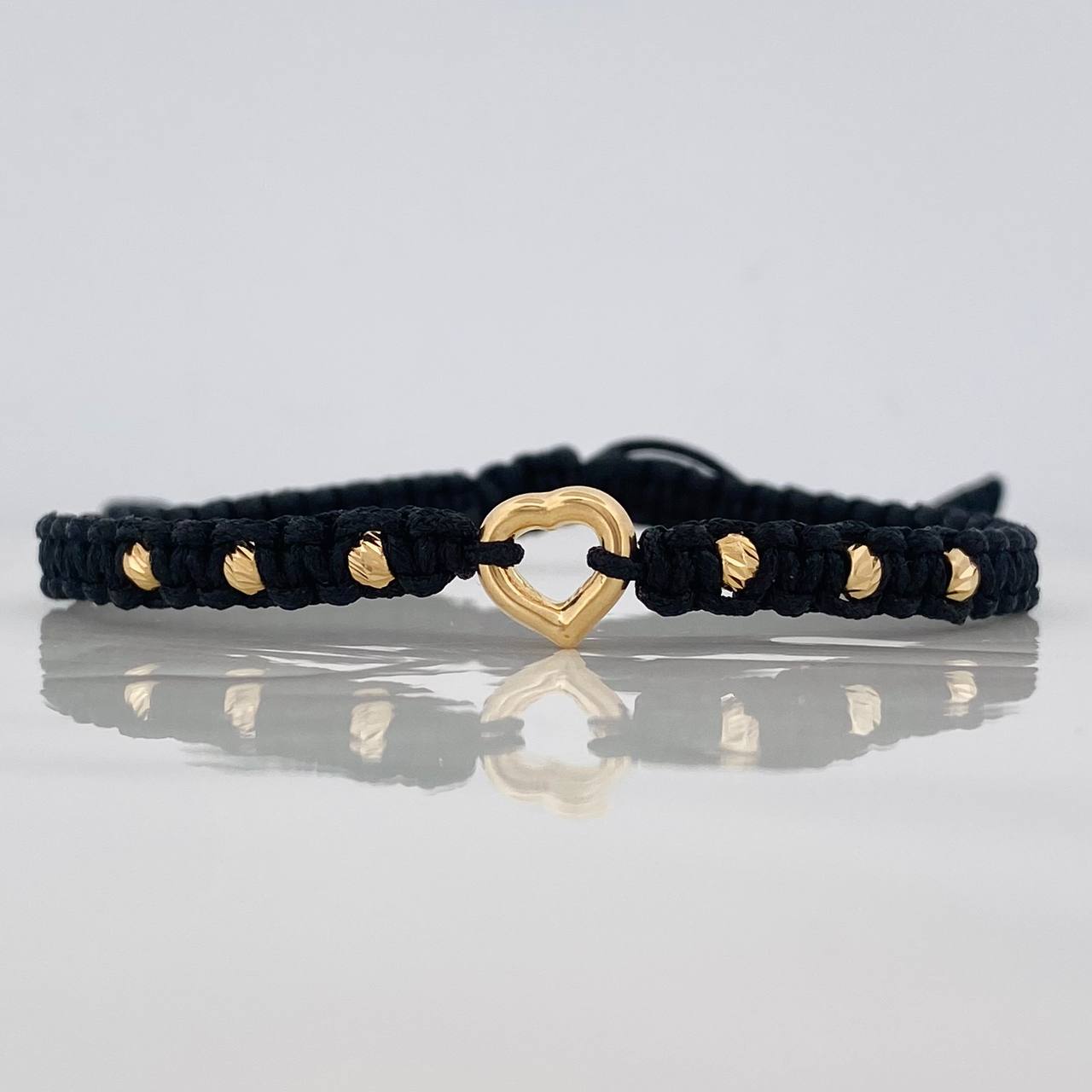 Pulsera Tejida Negra Corazón Bolas Diamantadas Oro Amarillo 18K
