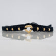 Pulsera Tejida Negra Corazón Bolas Diamantadas Oro Amarillo 18K