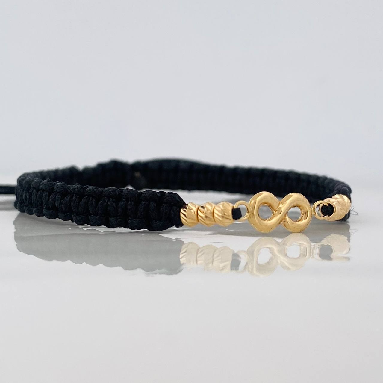 Black Woven Bracelet Infinity Diamond Cut Beads Yellow Gold 18K