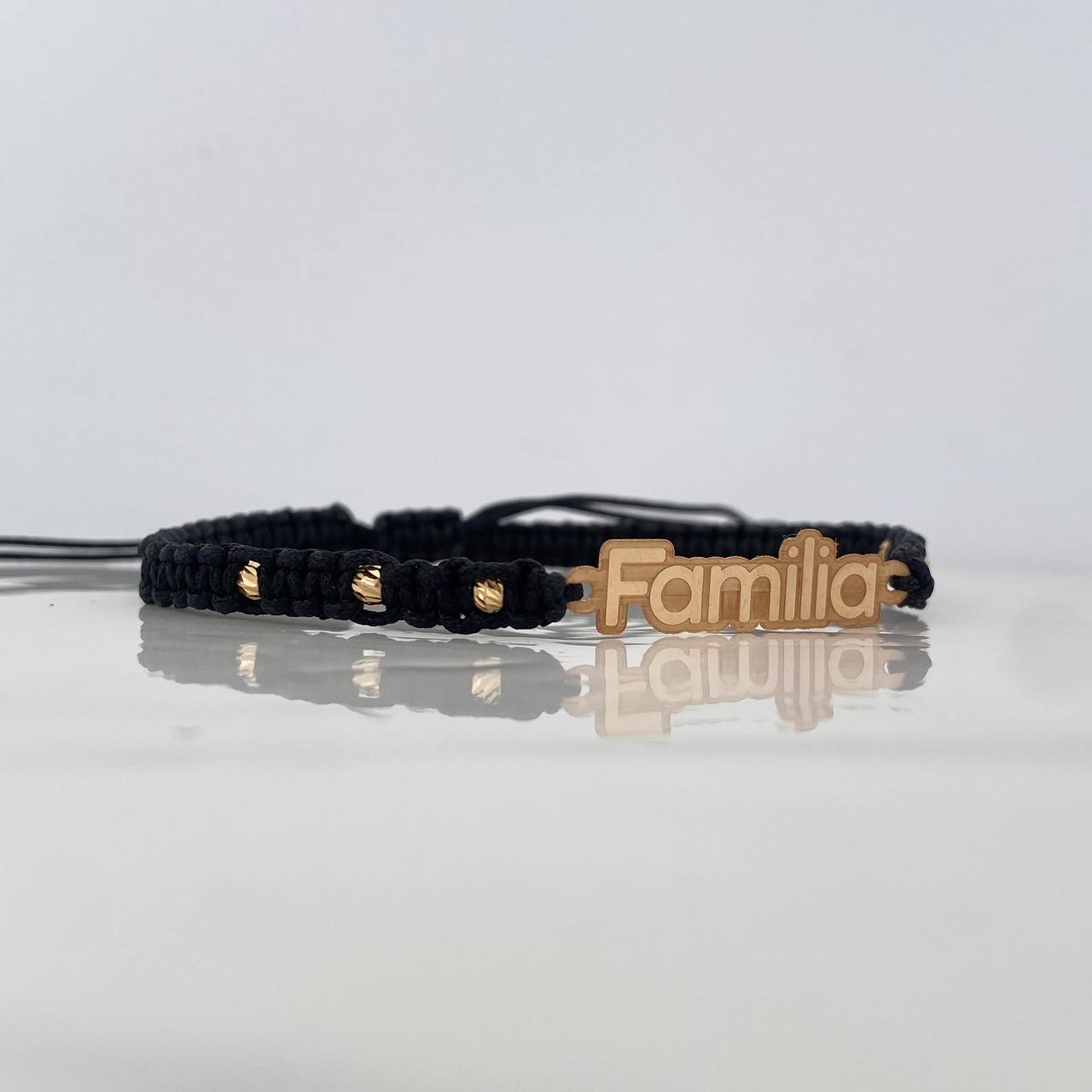 Pulsera Tejida Negra Familia Bolas Diamantadas Oro Amarillo 18K
