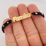 Pulsera Tejida Negra Familia Bolas Diamantadas Oro Amarillo 18K