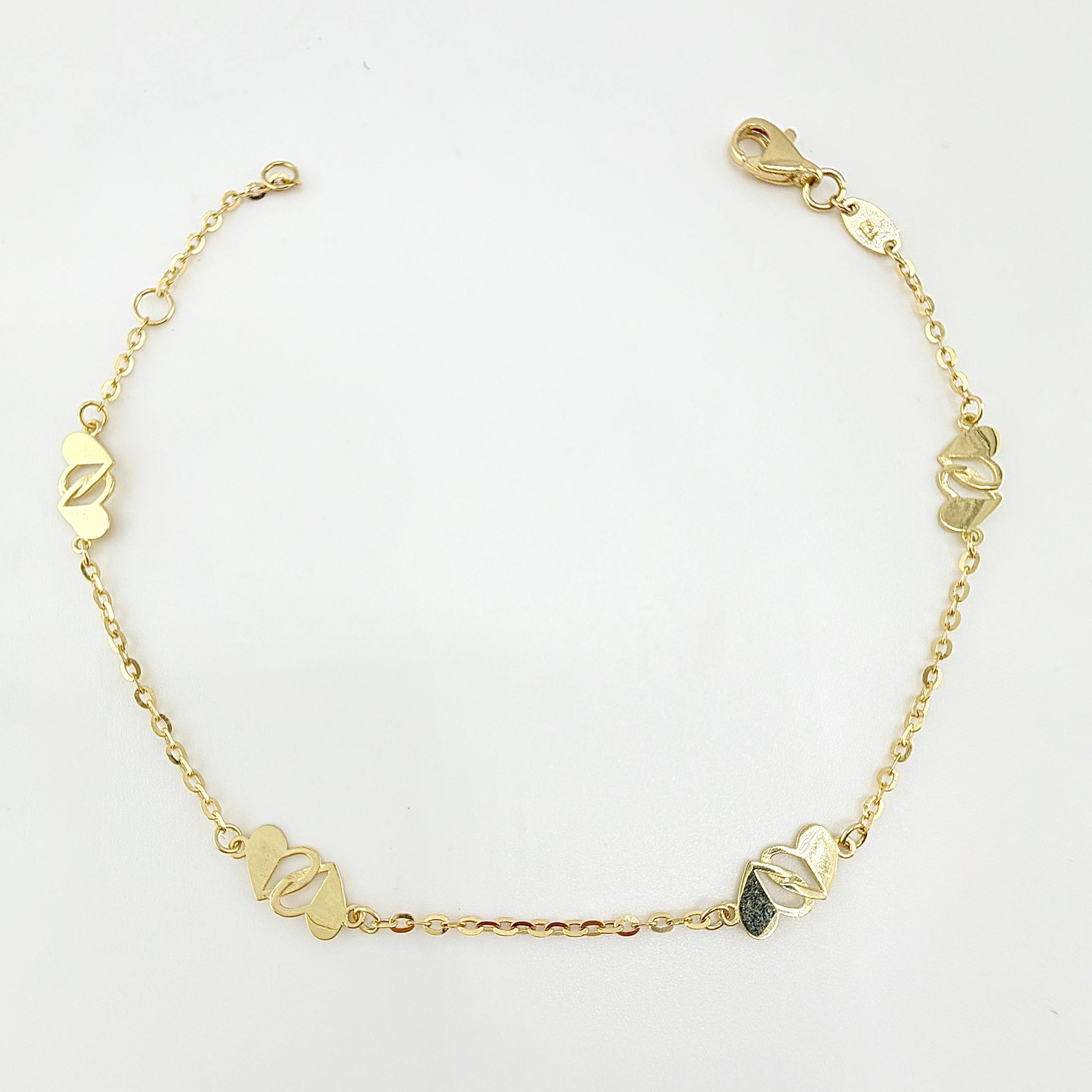 Pulso Aro Seguido Corazones Cruzados 1.95gr / 7 1/2 in / 1.2mm Oro Amarillo +4 18K ©