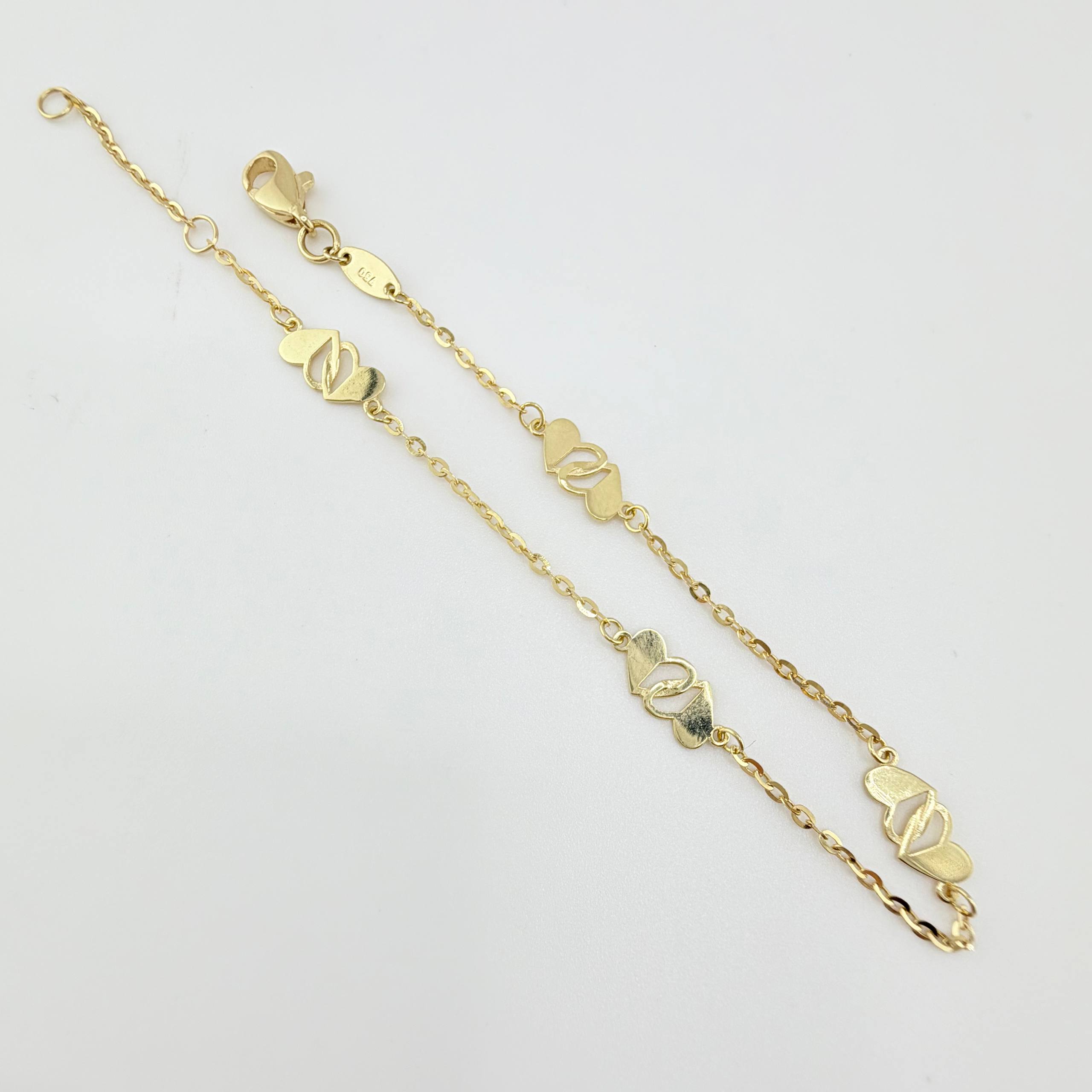 Pulso Aro Seguido Corazones Cruzados 1.95gr / 7 1/2 in / 1.2mm Oro Amarillo +4 18K ©