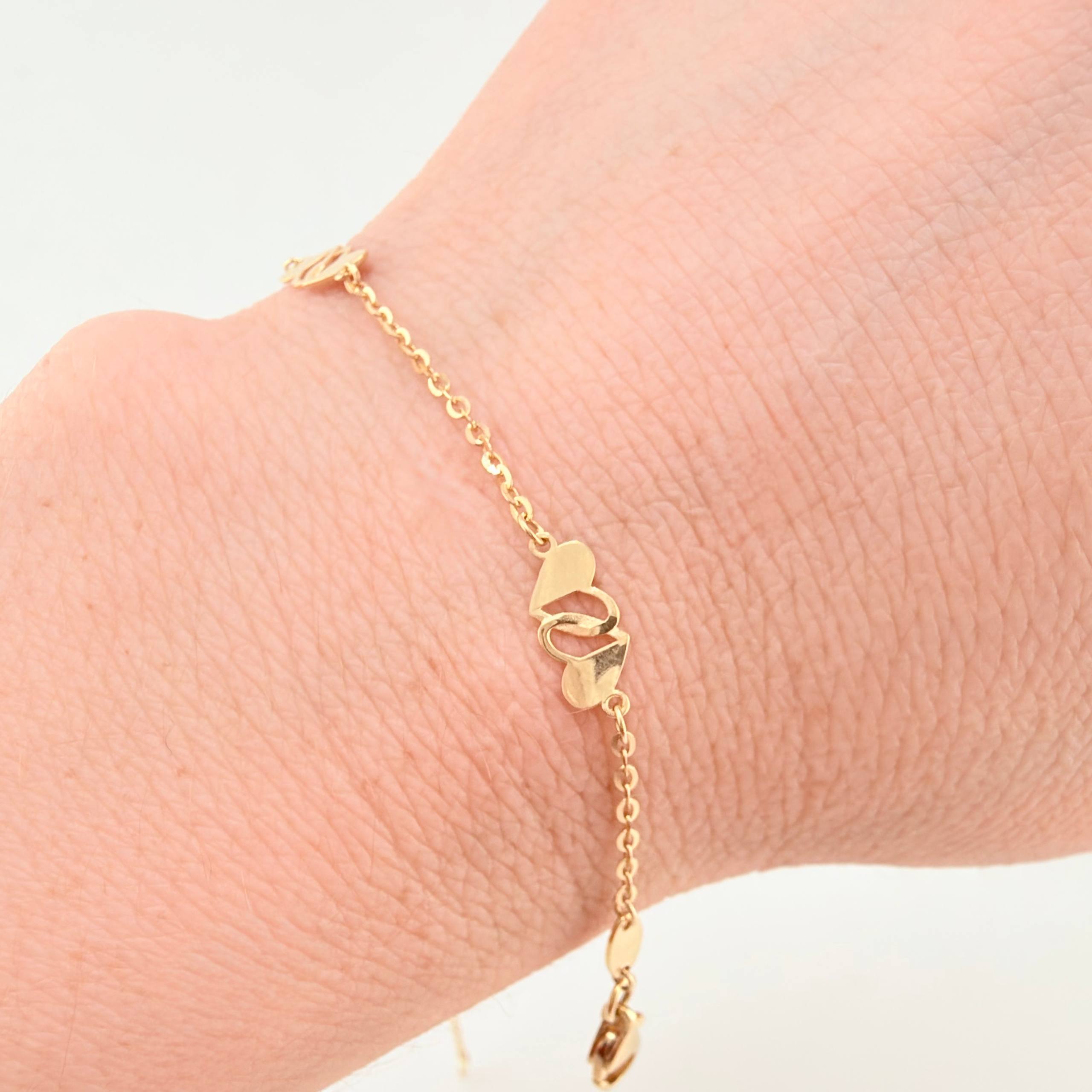 Pulso Aro Seguido Corazones Cruzados 1.95gr / 7 1/2 in / 1.2mm Oro Amarillo +4 18K ©