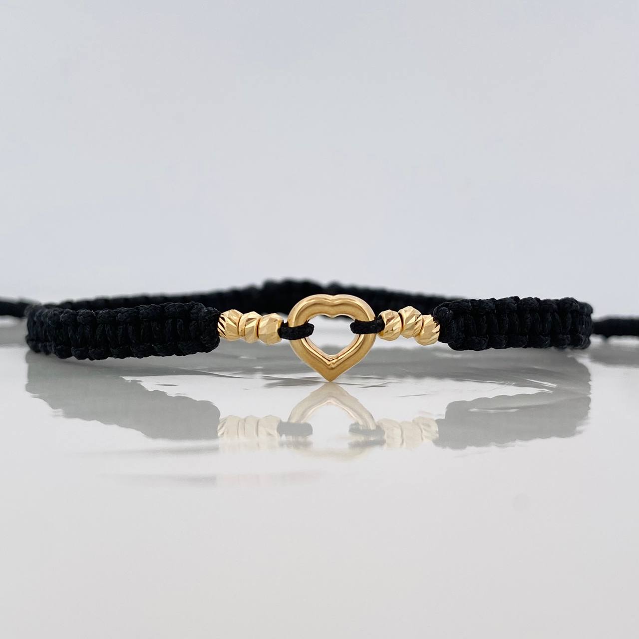 Pulsera Tejida Negra Silueta Corazón Oro Amarillo 18K