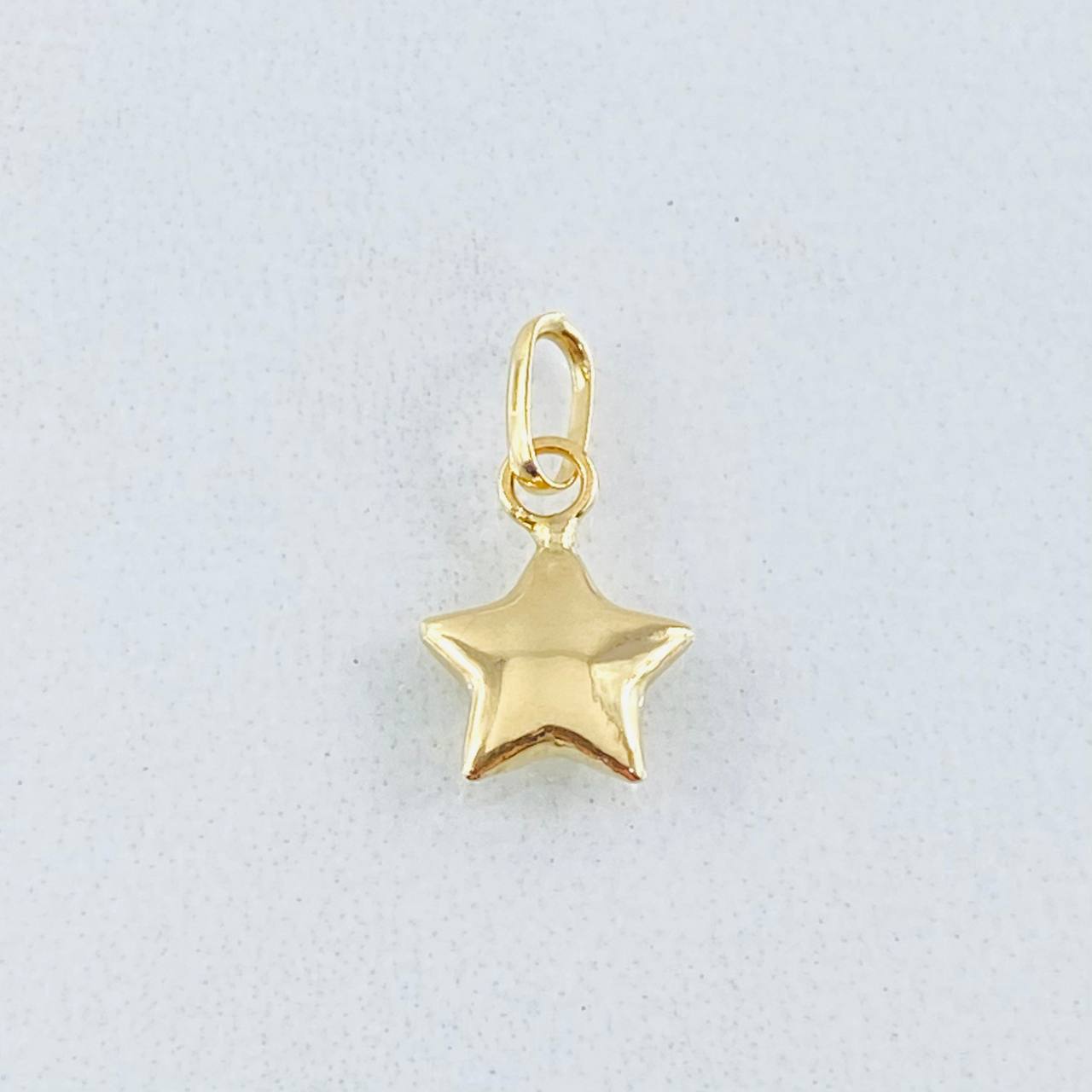Dije Estrella 0.25gr / 1/2 in / Oro Amarillo 18K *