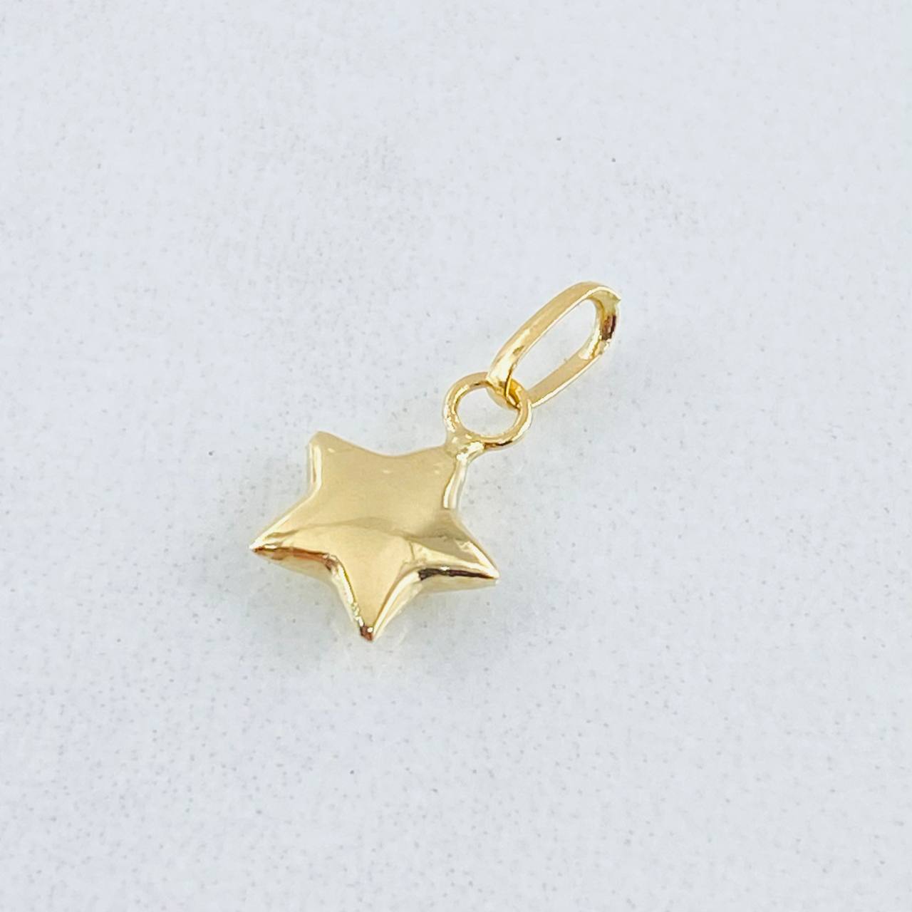 Dije Estrella 0.25gr / 1/2 in / Oro Amarillo 18K *