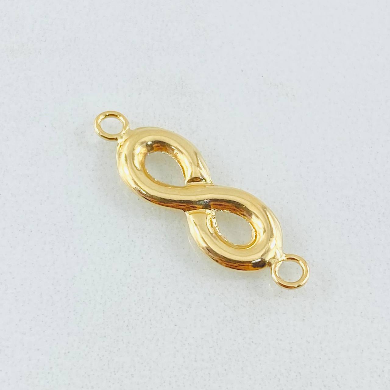 Infinity Charm 0.6gr / 1in / 18K Gold ©