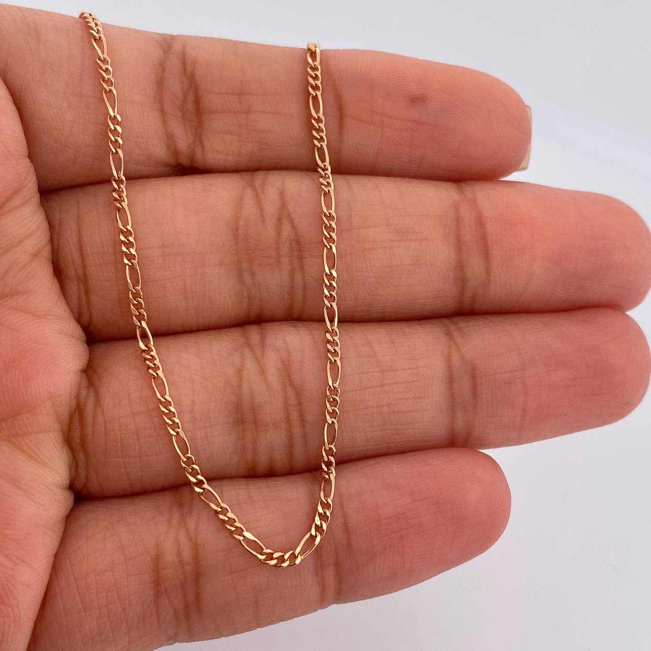 Cadena Figaro 1.4gr / 17 3/4 in / 2mm Oro Rosa +1 18K $