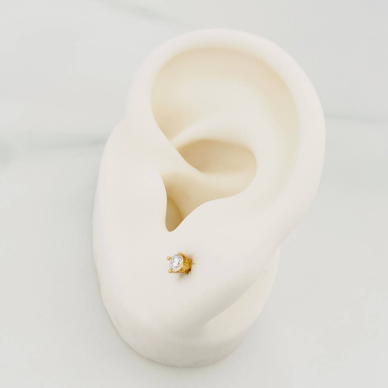Topos Cuatro Garras 0.8 g / in / 2.76 mm Oro Amarillo 18K